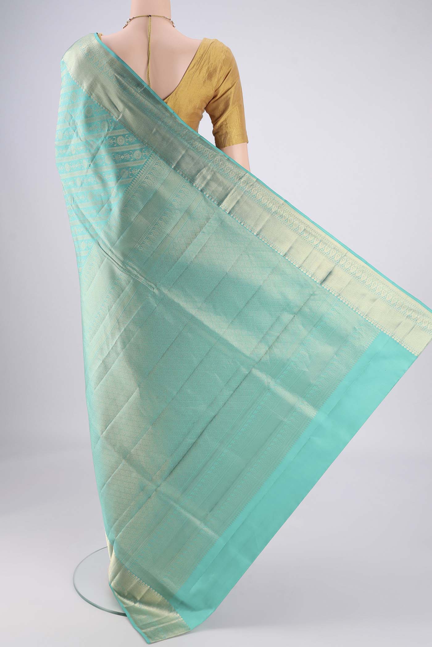 Flat view of Turquoise Soft Silk Saree with Zari Brocade on the body and Zari Border. 