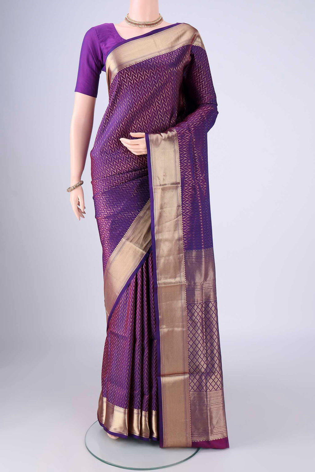 Purple Soft Silk Saree with Zari Brocade on the body and Zari Border.  displayed on a mannequin