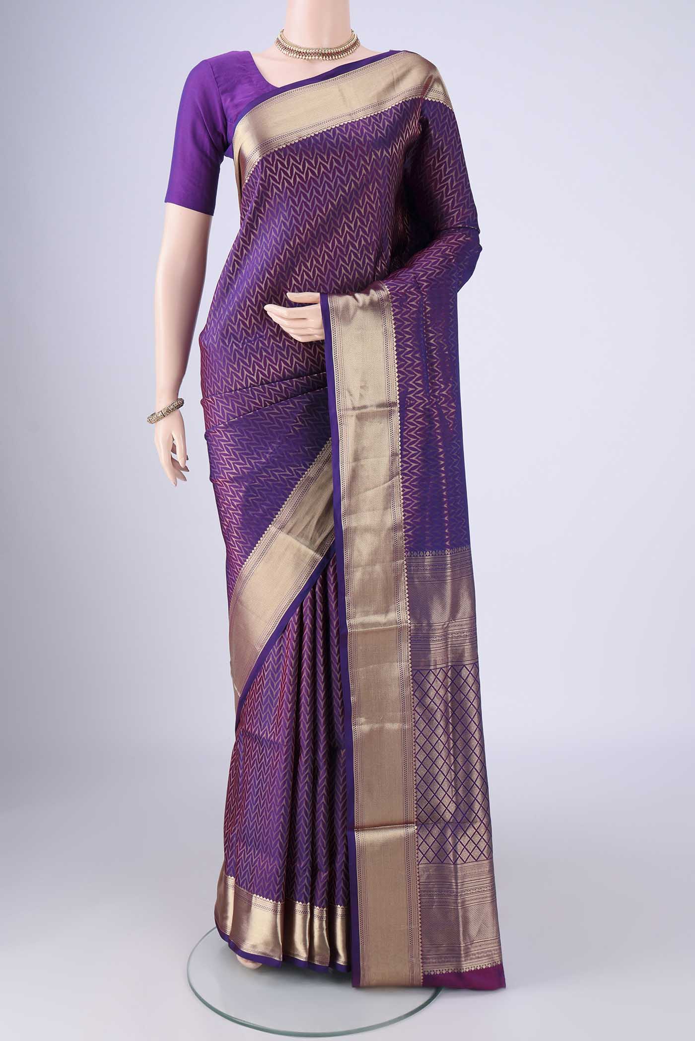 Purple Soft Silk Saree with Zari Brocade on the body and Zari Border.  displayed on a mannequin