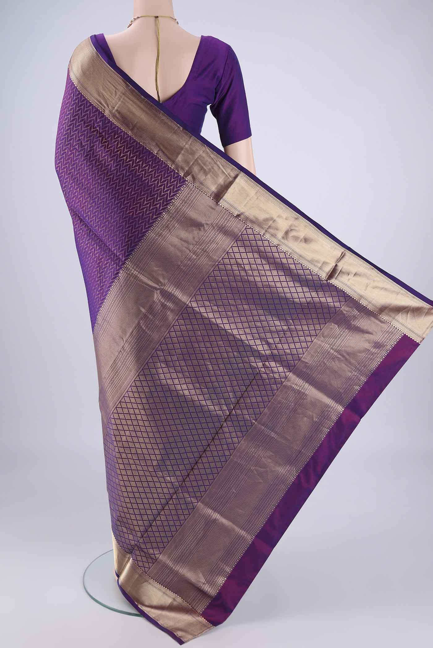 Flat view of Purple Soft Silk Saree with Zari Brocade on the body and Zari Border. 