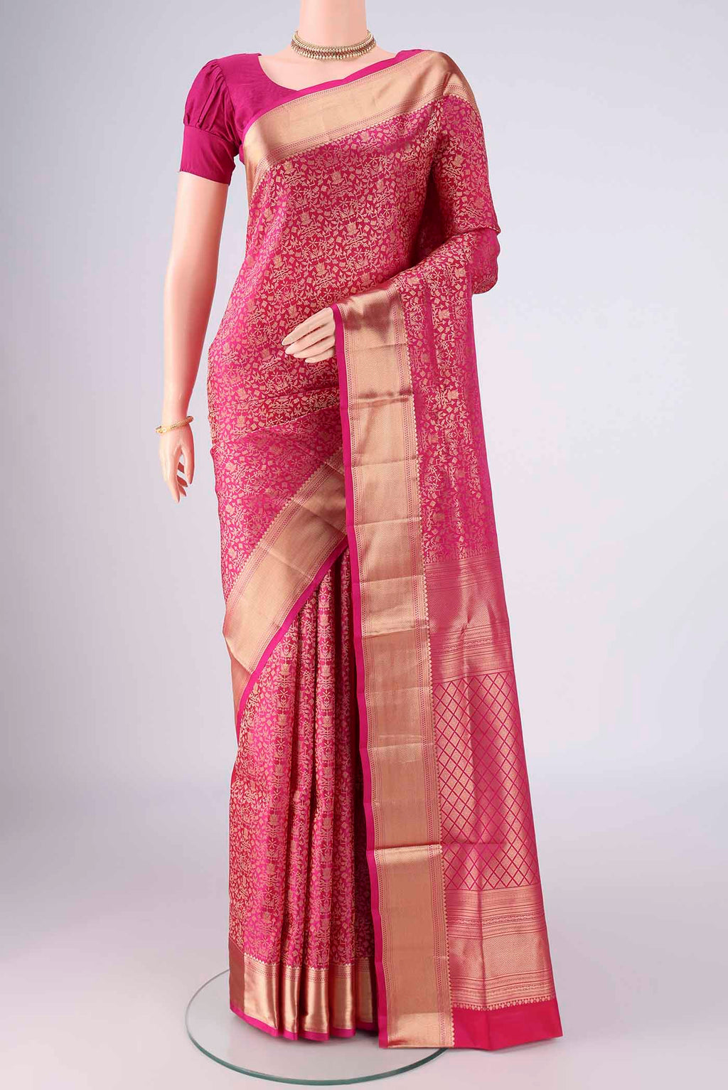 Rani Pink Soft Silk Saree with Zari Brocade on the body and Zari Border.  displayed on a mannequin
