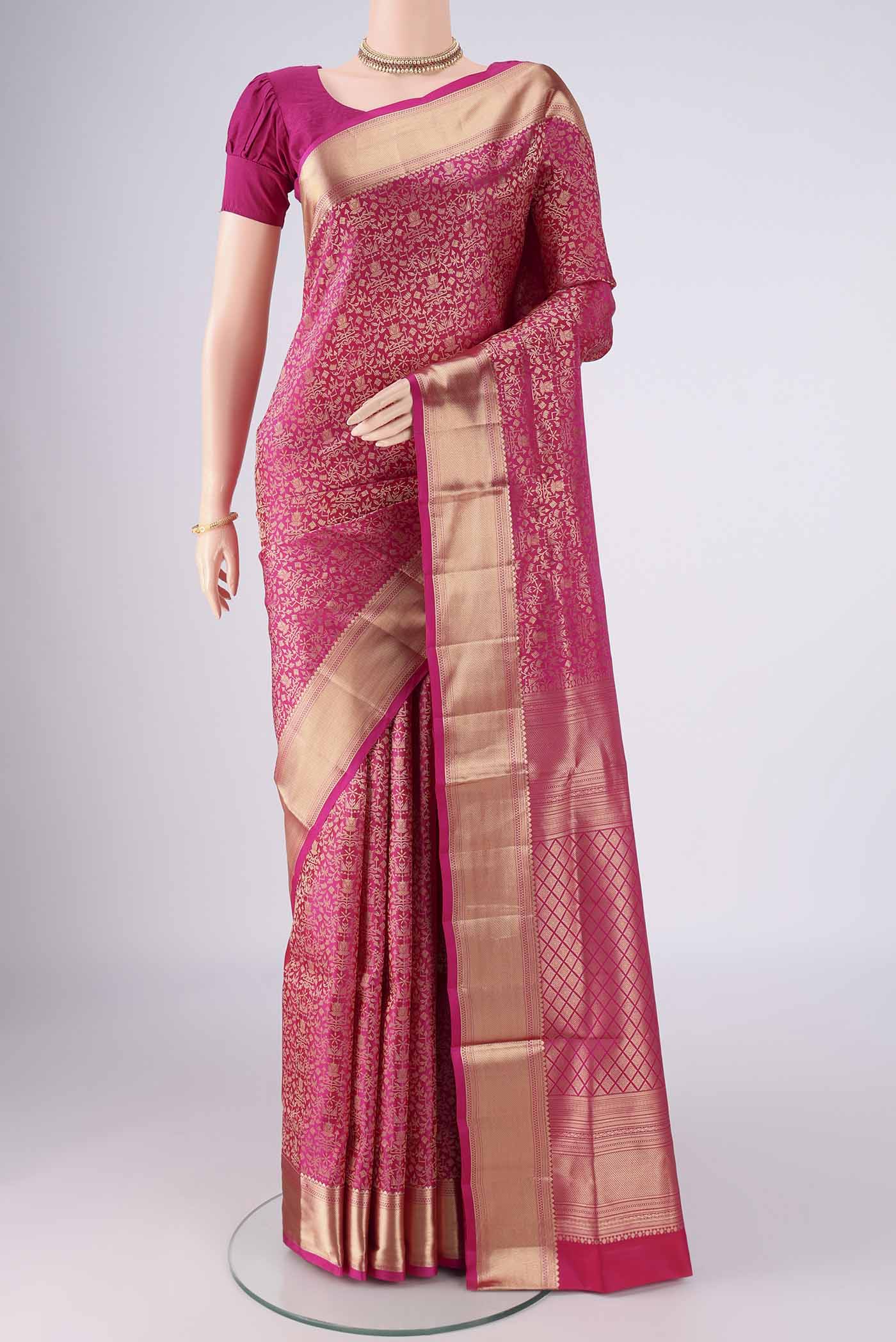 Rani Pink Soft Silk Saree with Zari Brocade on the body and Zari Border.  displayed on a mannequin