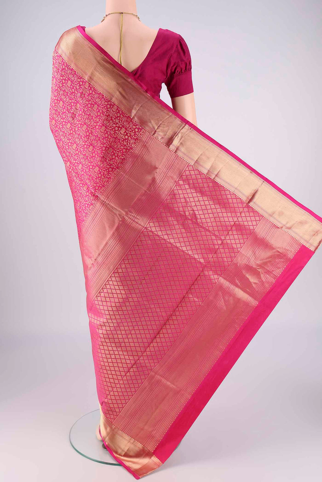Flat view of Rani Pink Soft Silk Saree with Zari Brocade on the body and Zari Border. 