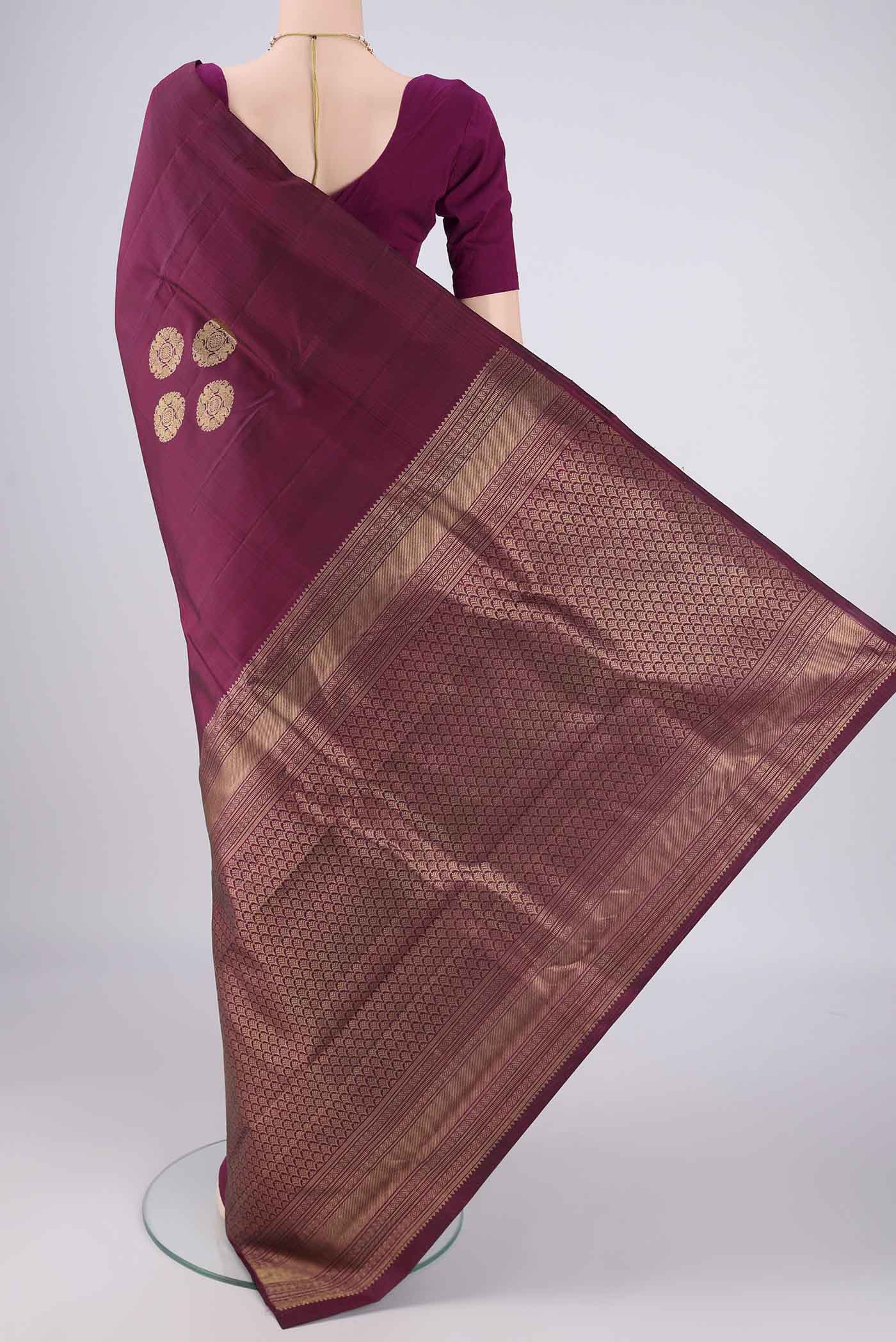 Flat view of Maroon Kanchipuram Silk Saree with Zari Butta on the body and Without Border. 