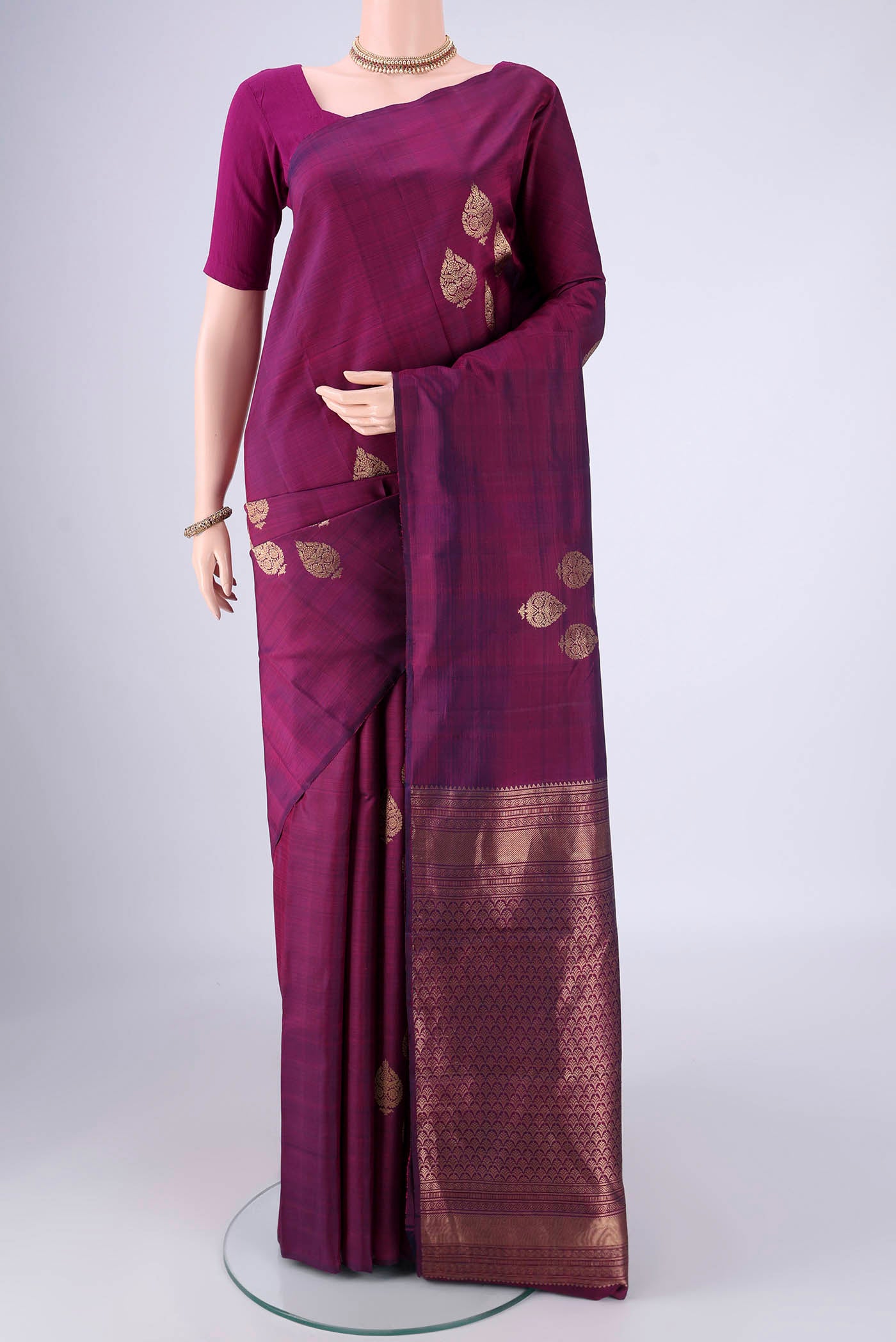 Purple Soft Silk Saree with Zari Butta on the body and Without Border.  displayed on a mannequin