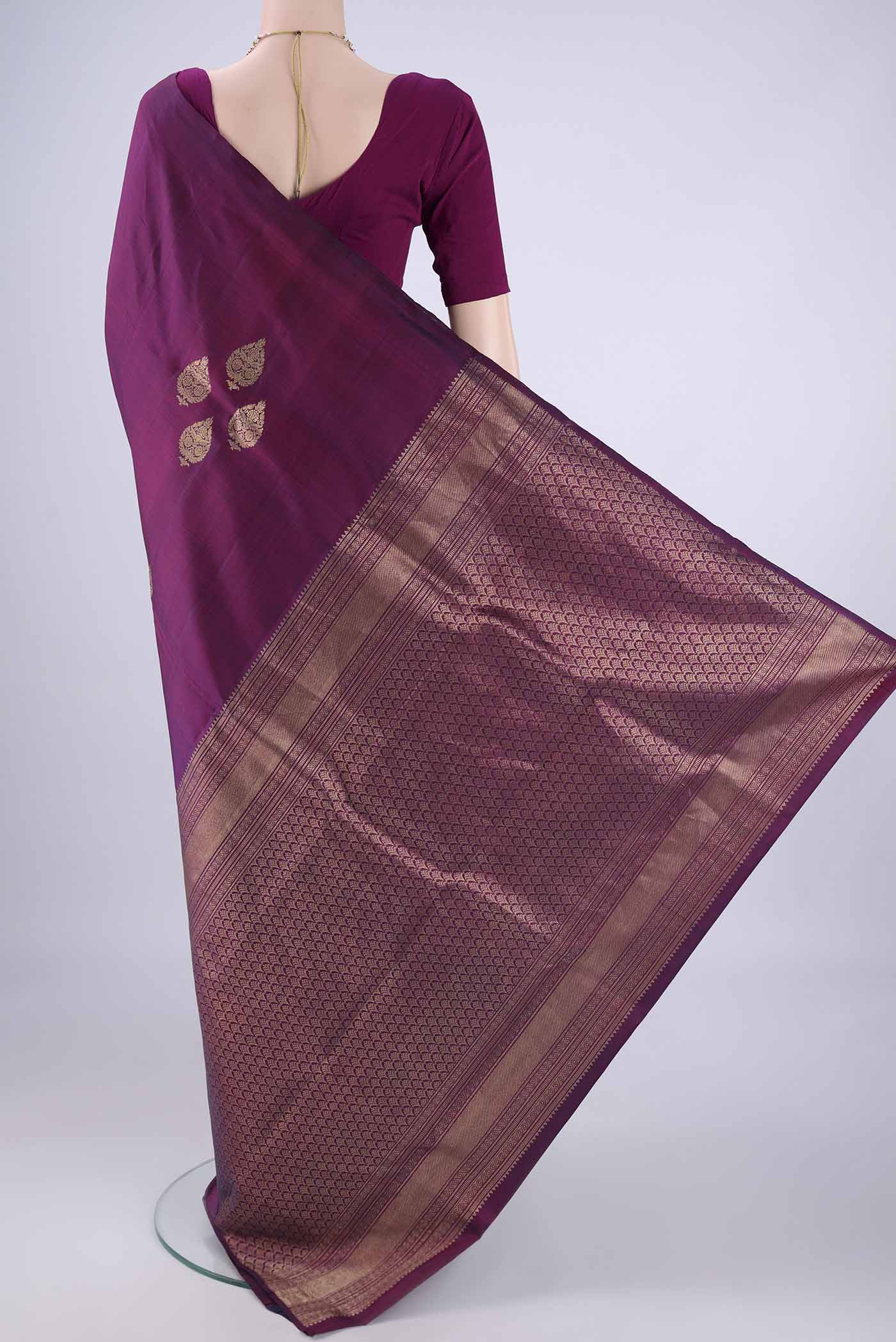 Flat view of Purple Soft Silk Saree with Zari Butta on the body and Without Border. 