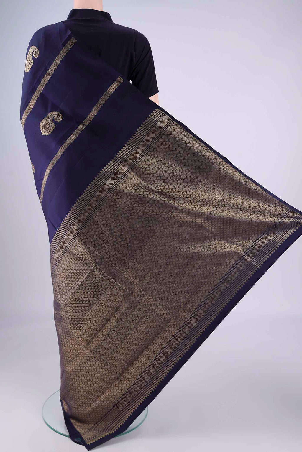 Flat view of Navy Blue Soft Silk Saree with Zari Butta on the body and Without Border. 