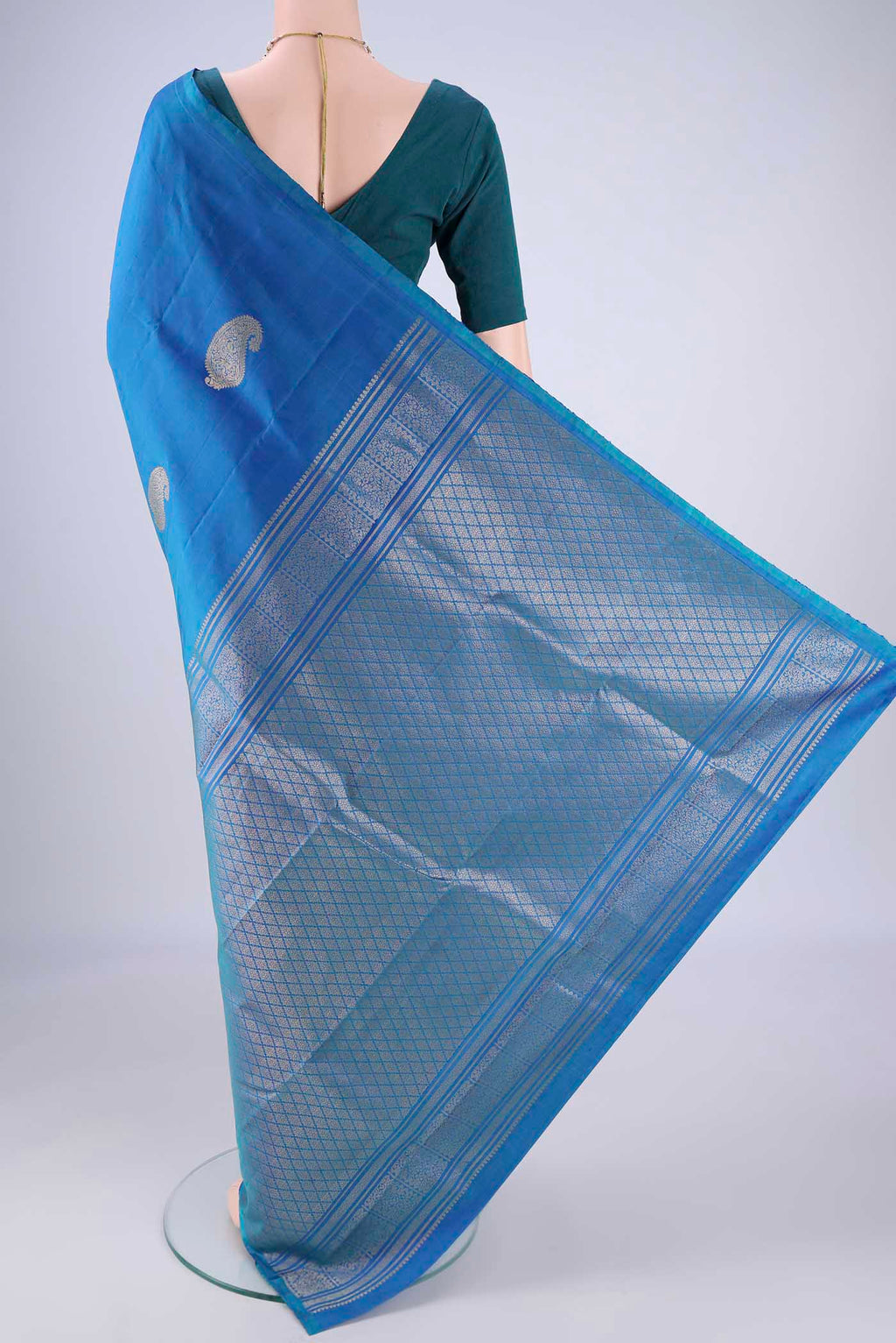 Flat view of Royal Blue Soft Silk Saree with Zari Butta on the body and Without Border. 
