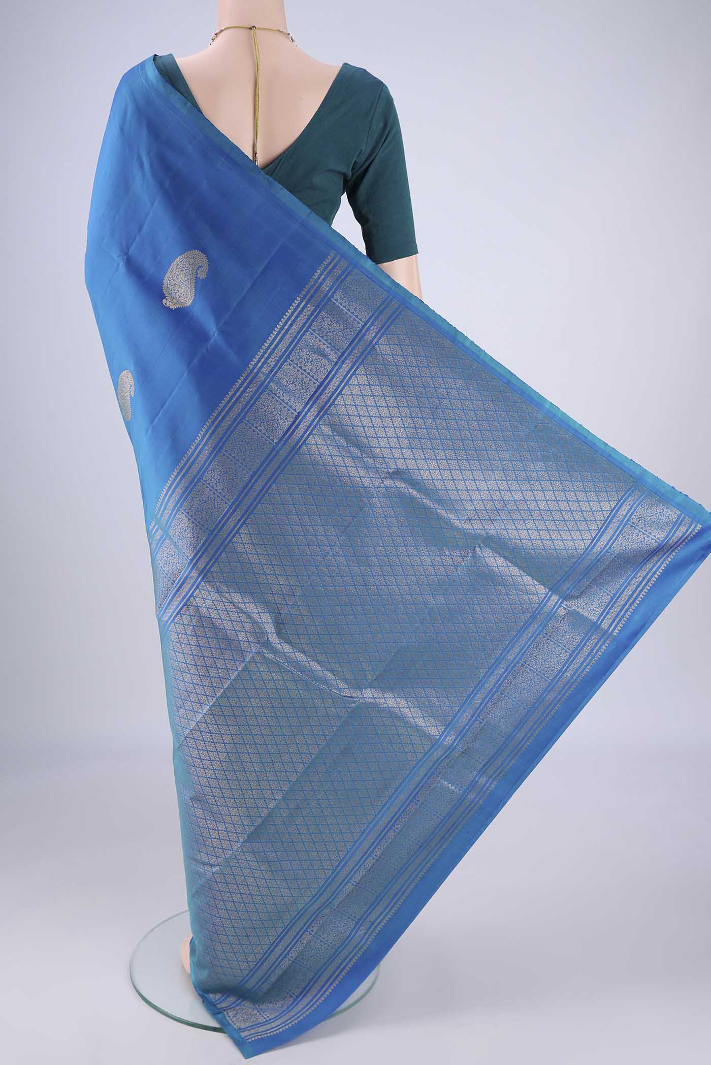 Flat view of Royal Blue Soft Silk Saree with Zari Butta on the body and Without Border. 