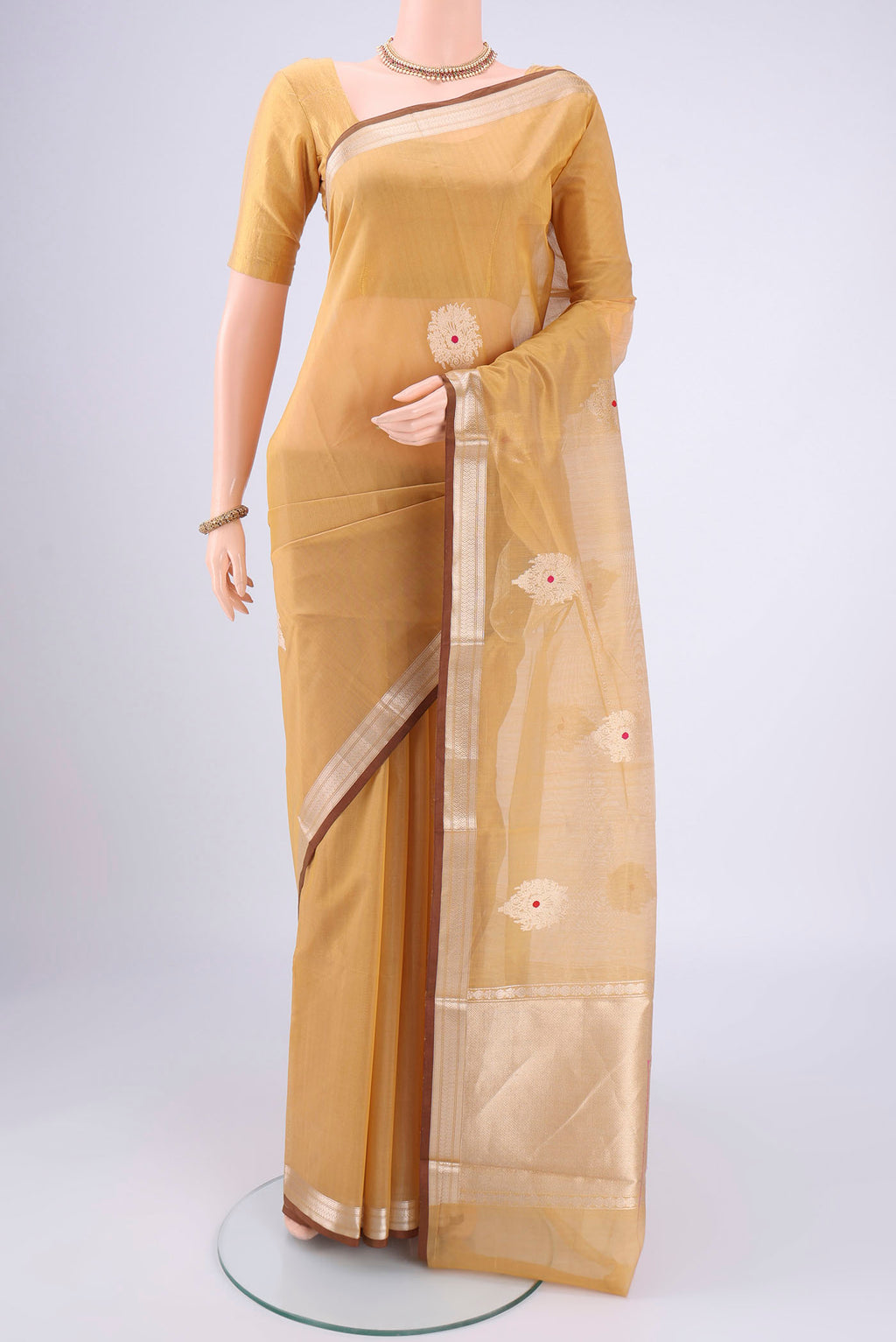 Dark Beige Chanderi Silk Cotton Saree with Zari Butta on the body and Zari Border.  displayed on a mannequin