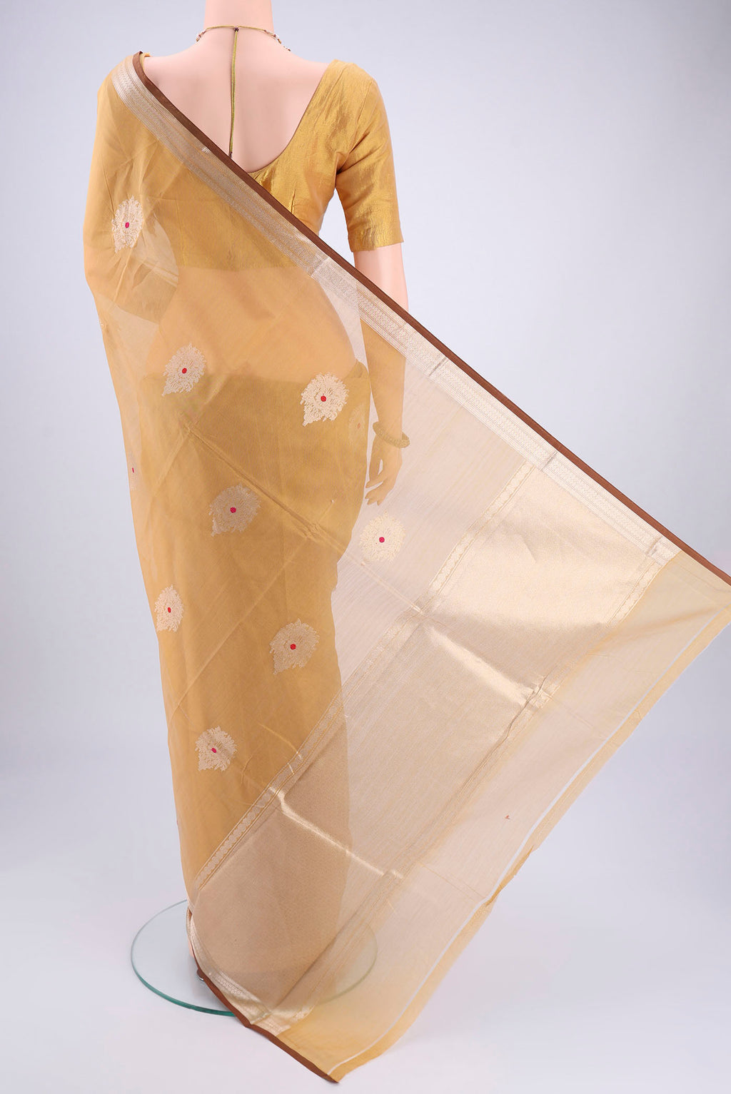 Flat view of Dark Beige Chanderi Silk Cotton Saree with Zari Butta on the body and Zari Border. 