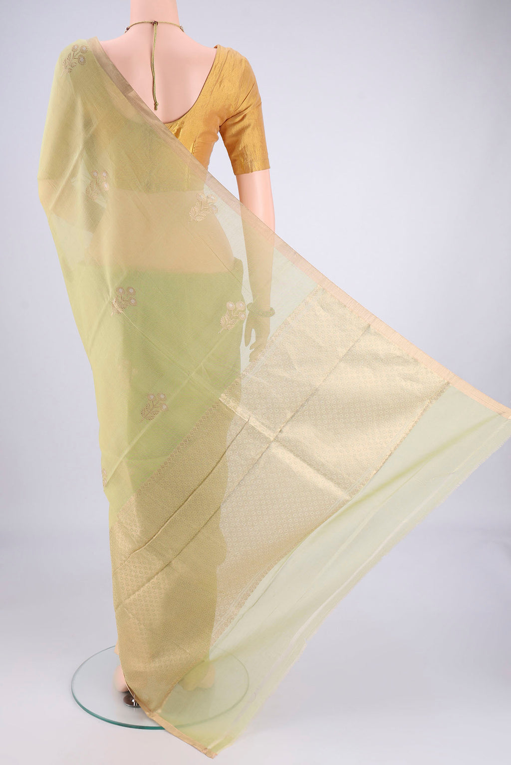 Flat view of Light Green Chanderi Silk Cotton Saree with Zari Butta on the body and Zari Border. 