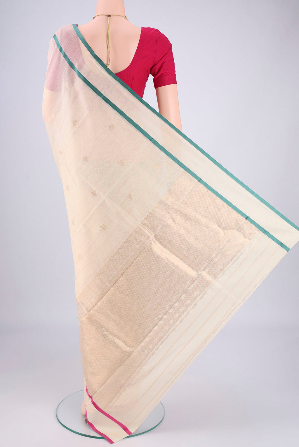 Flat view of Off White Chanderi Silk Cotton Saree with Zari Butta on the body and Ganga Jamuna Border. 