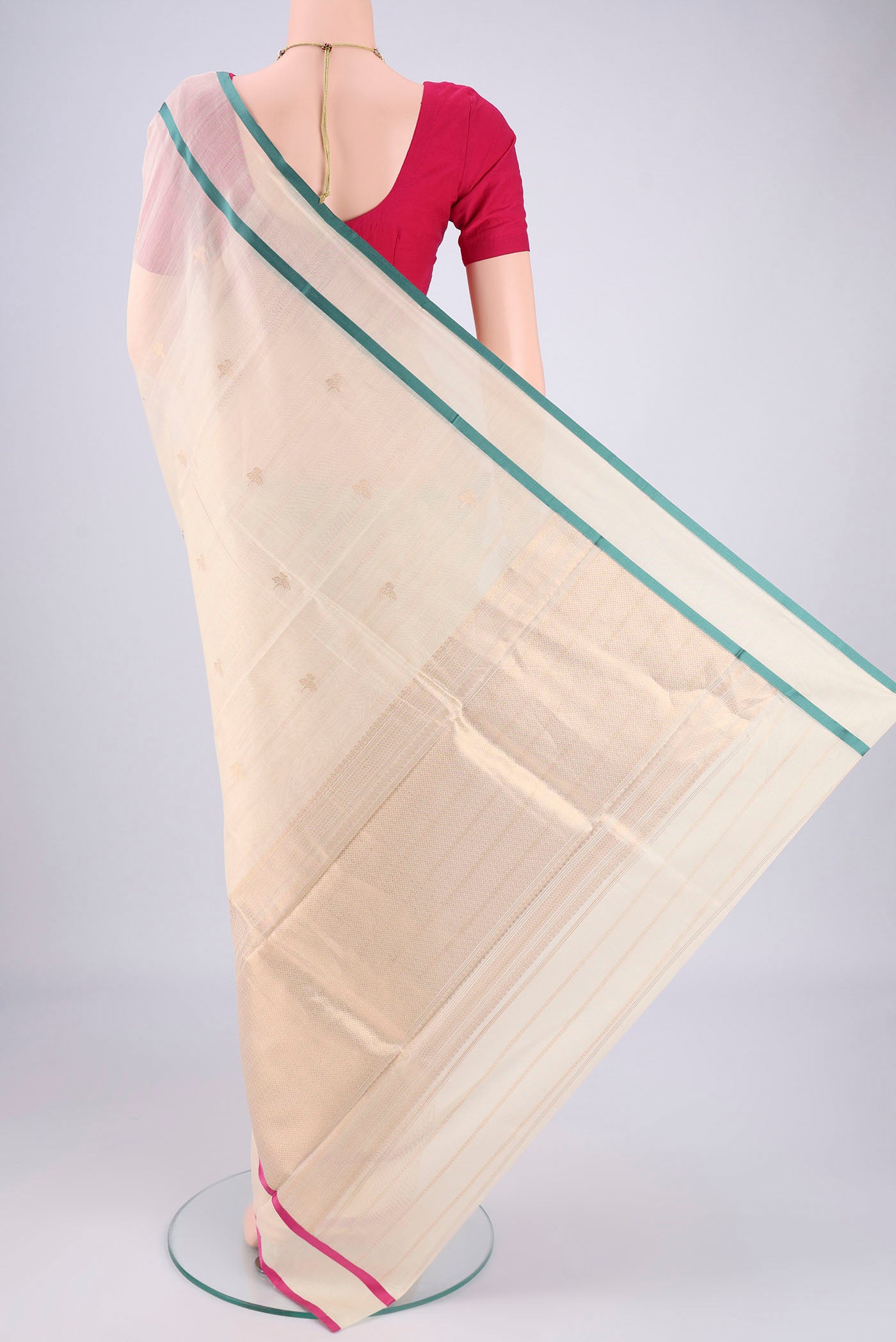 Flat view of Off White Chanderi Silk Cotton Saree with Zari Butta on the body and Ganga Jamuna Border. 