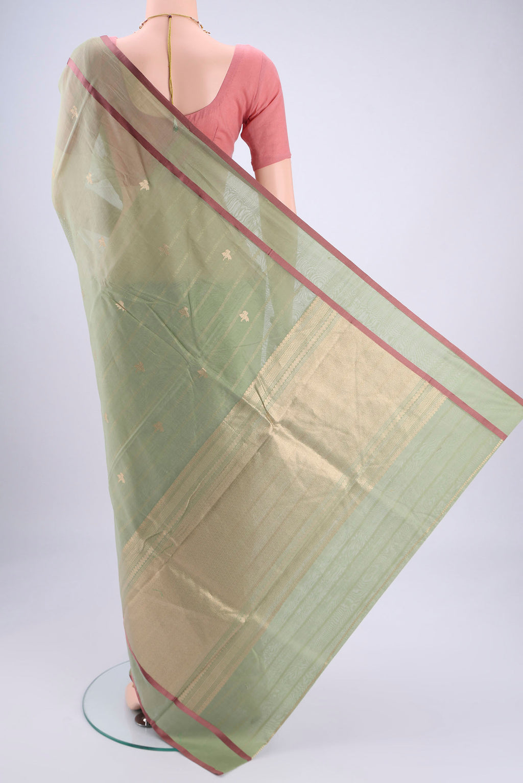 Flat view of Sage Green Chanderi Silk Cotton Saree with Zari Butta on the body and Thread Border. 