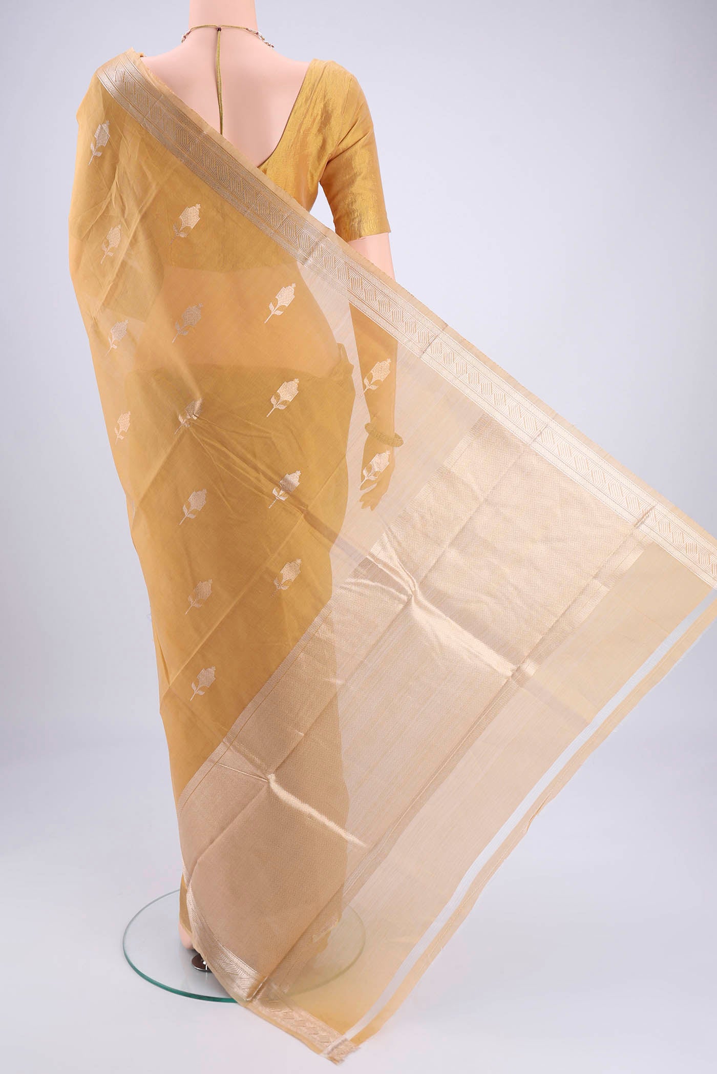 Flat view of Dark Beige Chanderi Silk Cotton Saree with Zari Butta on the body and Zari Border. 