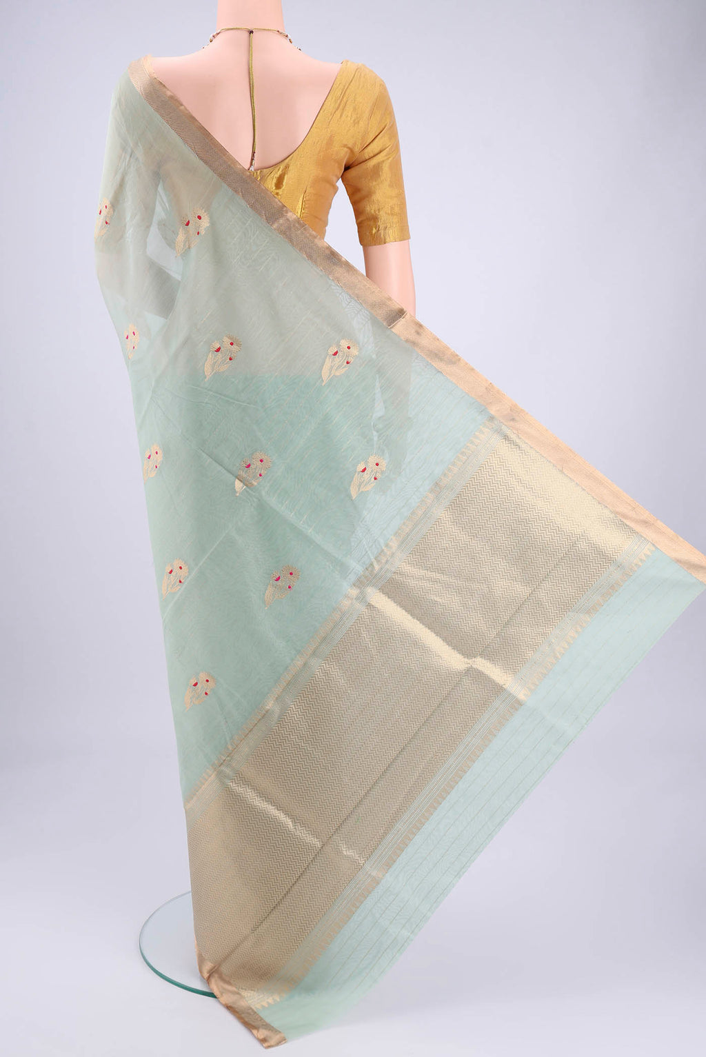 Flat view of Mint Green Chanderi Silk Cotton Saree with Zari Butta on the body and Zari Border. 