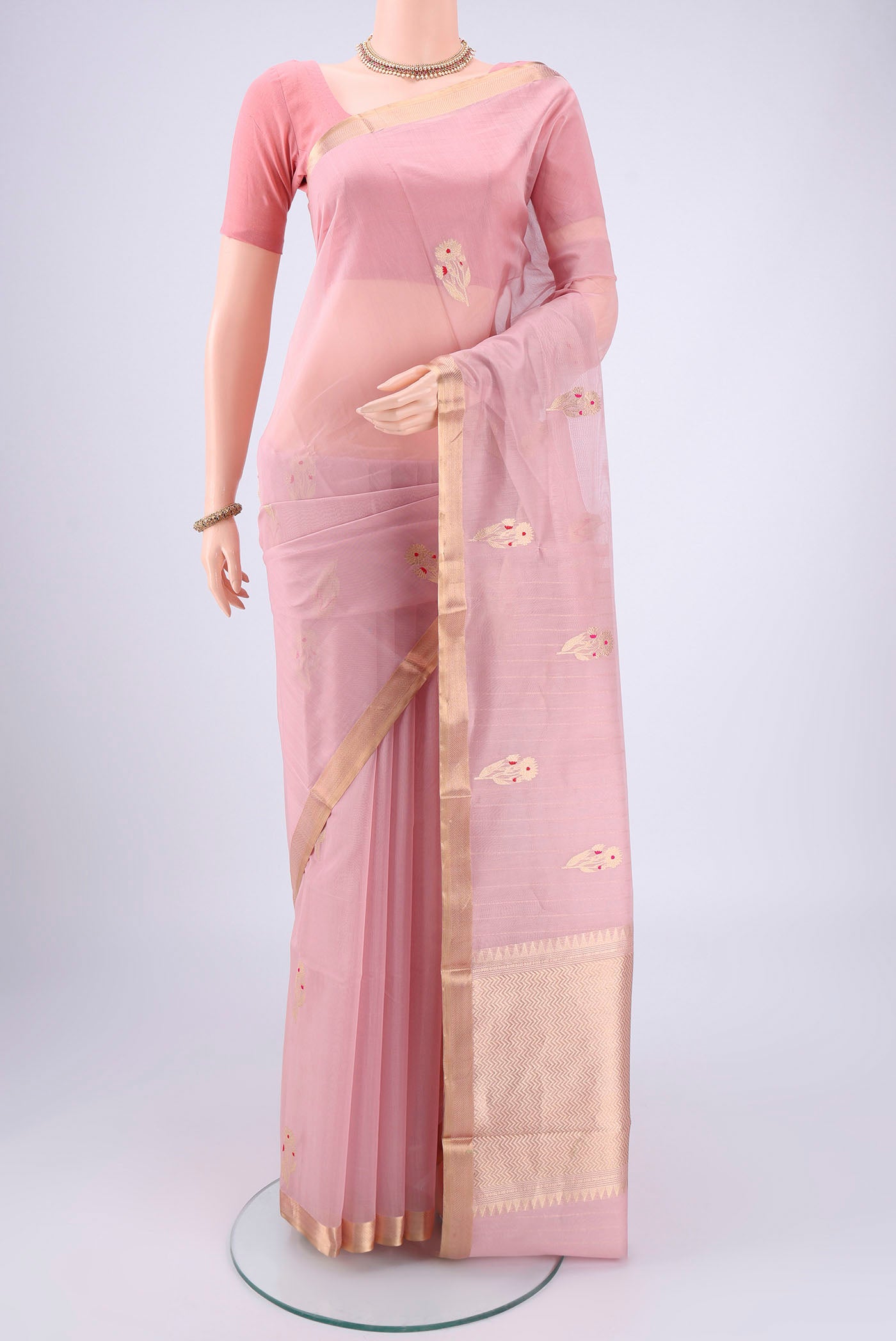 Pink Chanderi Silk Cotton Saree with Zari Butta on the body and Zari Border.  displayed on a mannequin