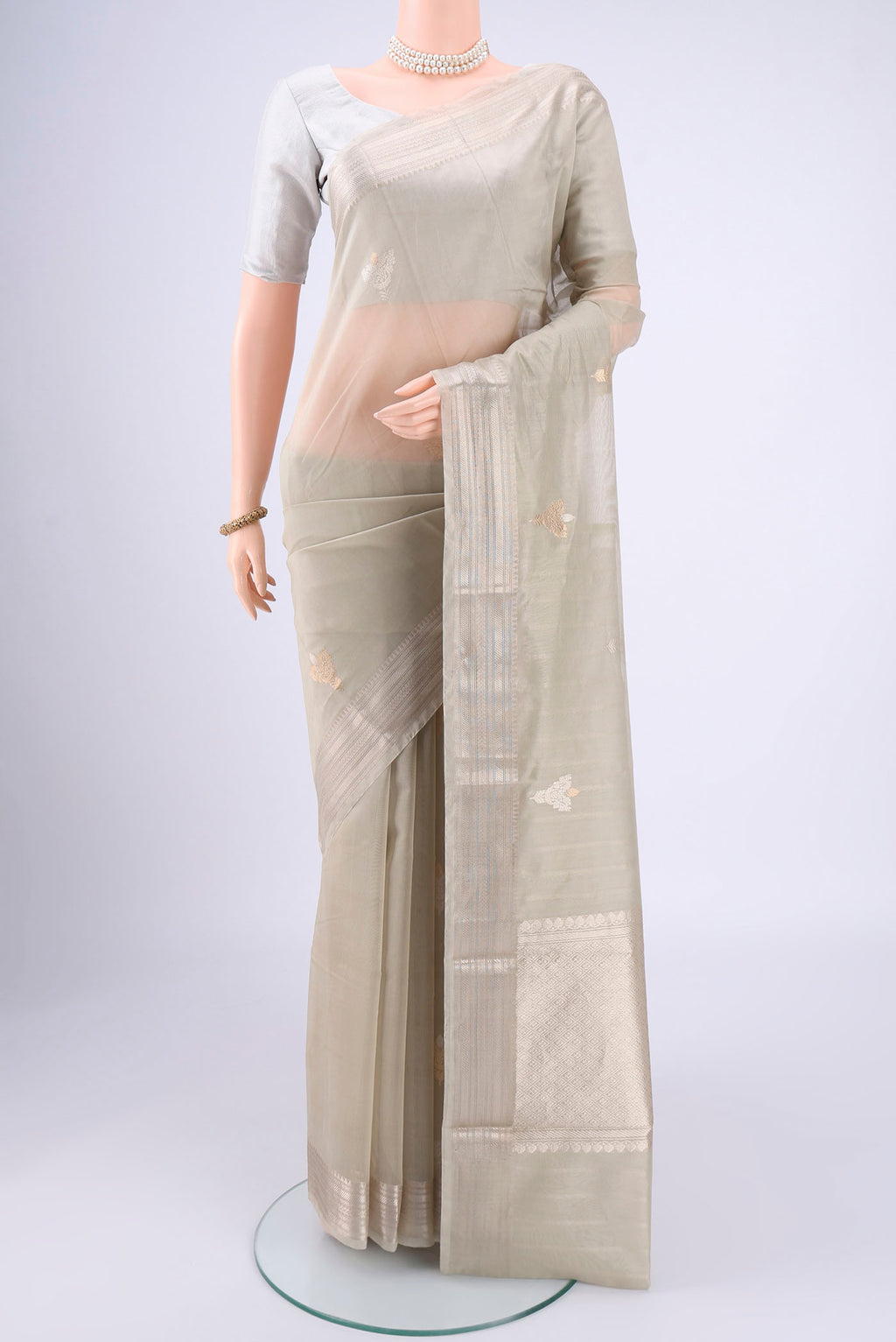 Davys Grey Chanderi Silk Cotton Saree with Zari Butta on the body and Zari Border.  displayed on a mannequin