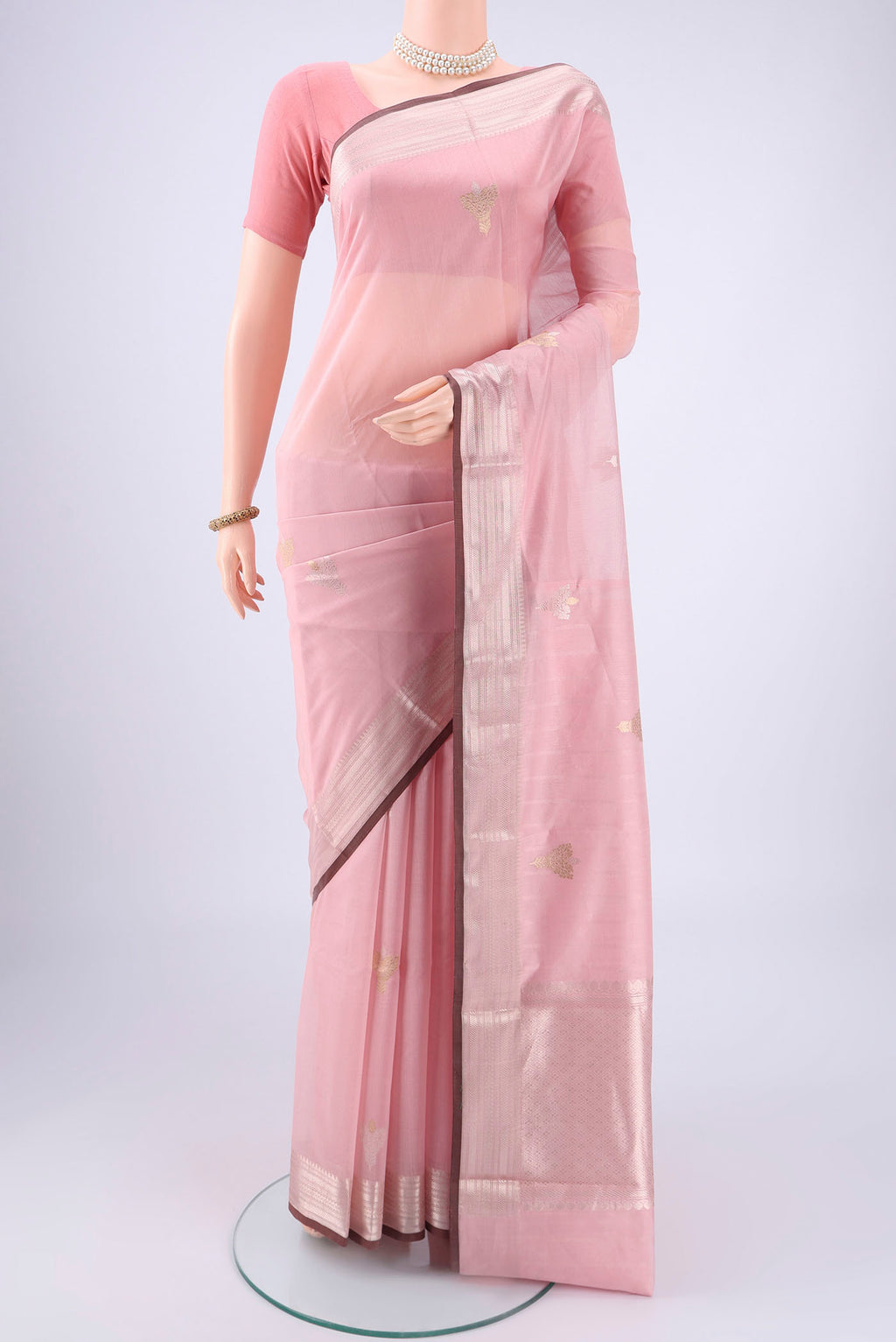 Rose pink Chanderi Silk Cotton Saree with Zari Butta on the body and Zari Border.  displayed on a mannequin