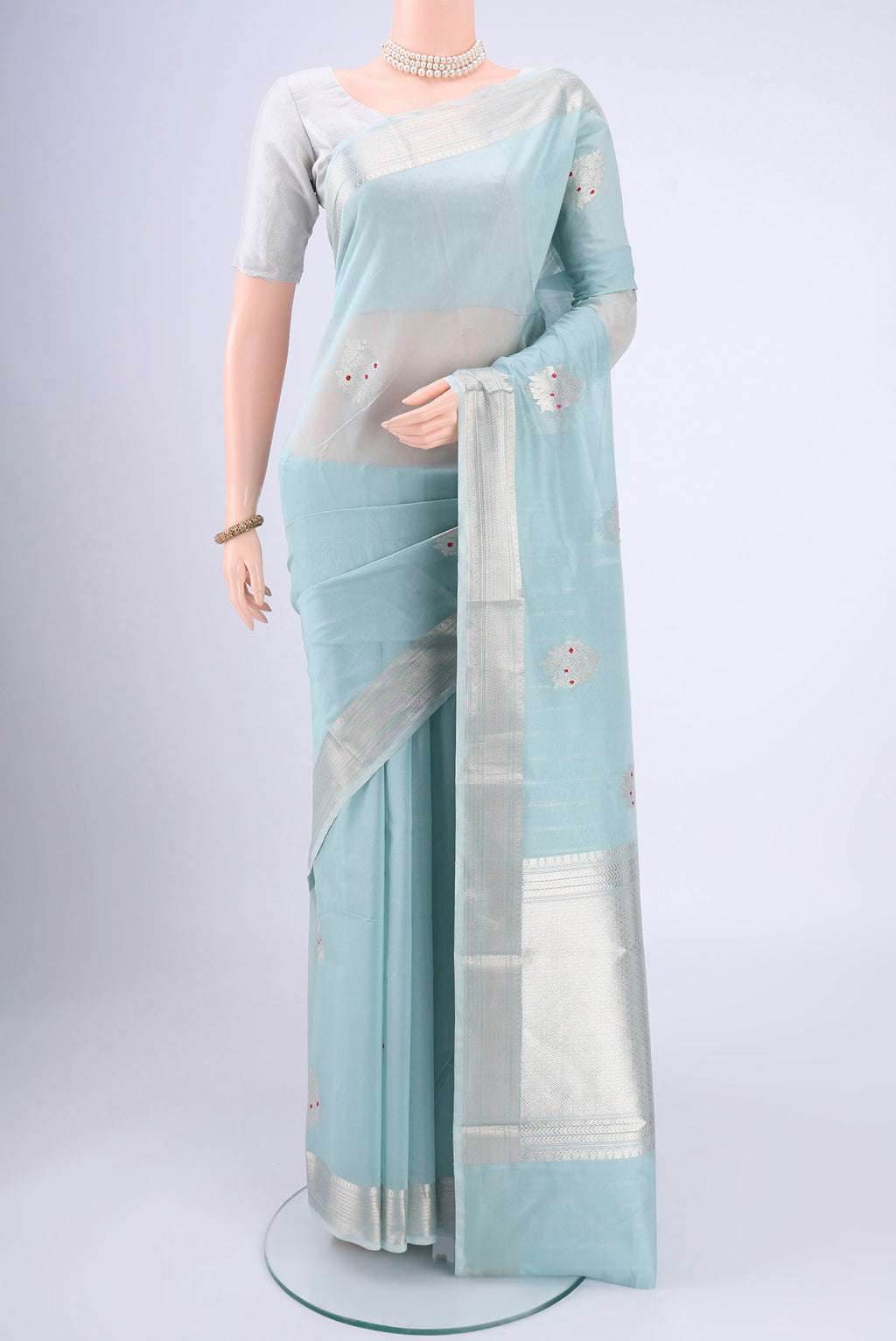 Sky Blue Chanderi Silk Cotton Saree with Zari Butta on the body and Zari Border.  displayed on a mannequin