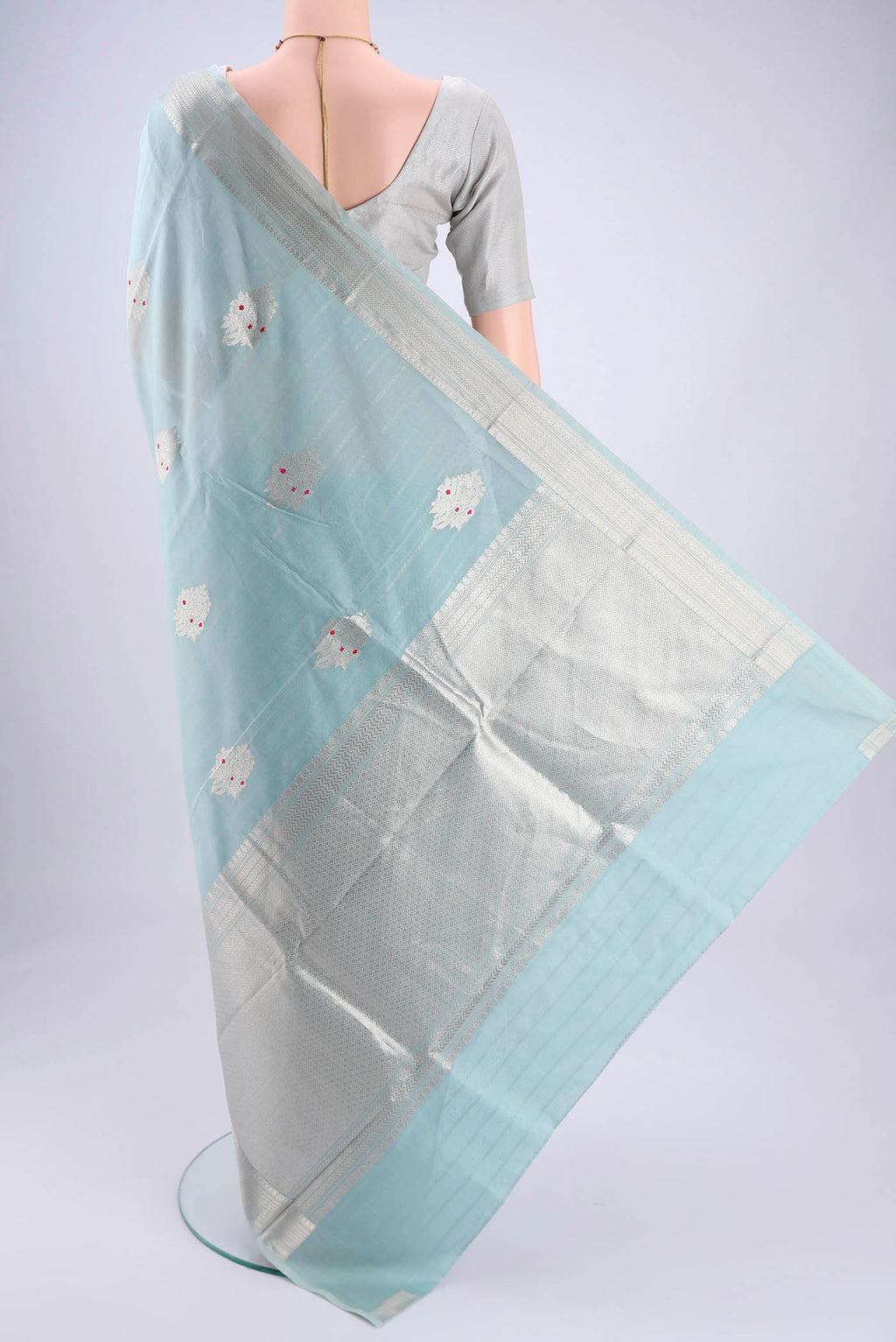 Flat view of Sky Blue Chanderi Silk Cotton Saree with Zari Butta on the body and Zari Border. 