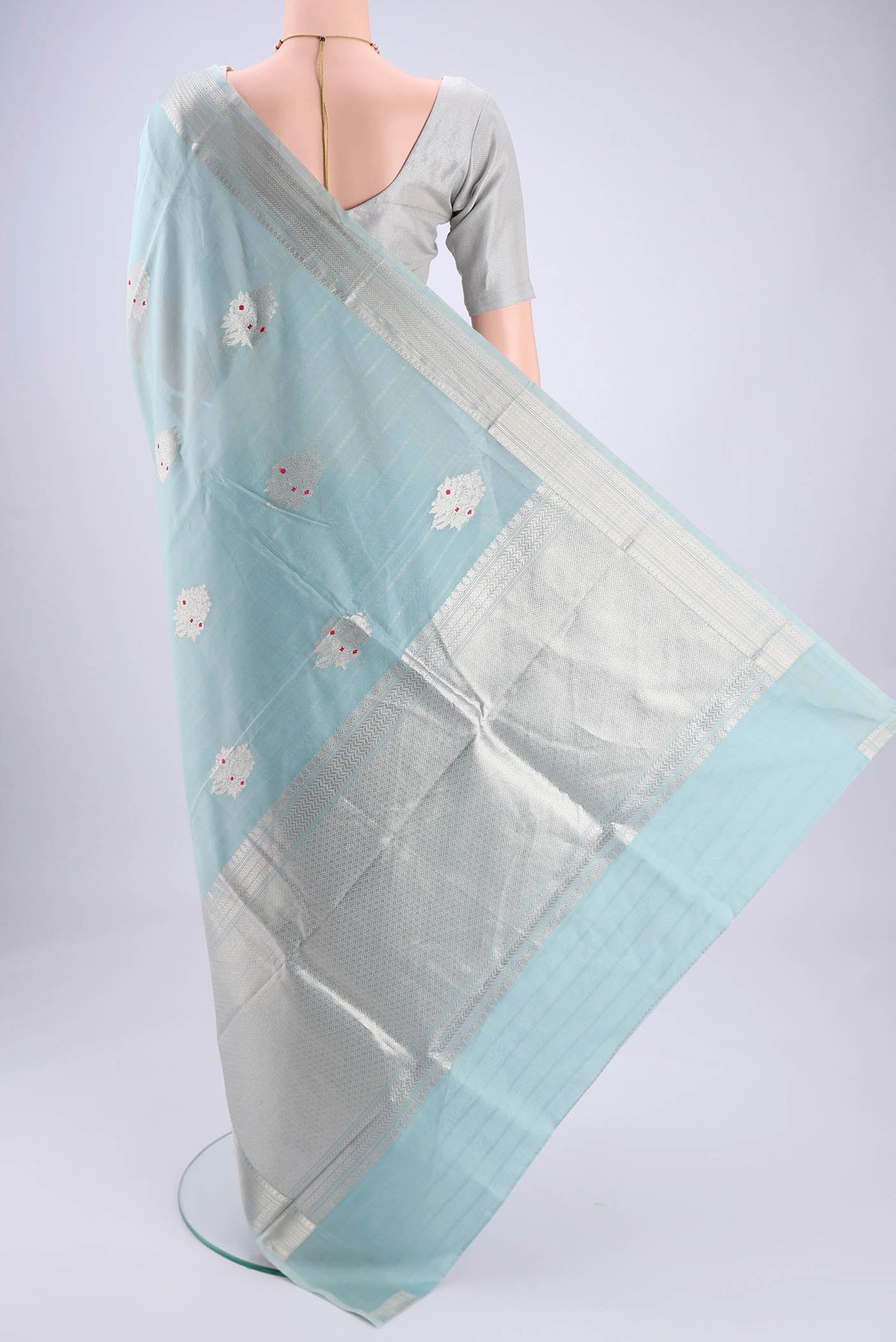 Flat view of Sky Blue Chanderi Silk Cotton Saree with Zari Butta on the body and Zari Border. 