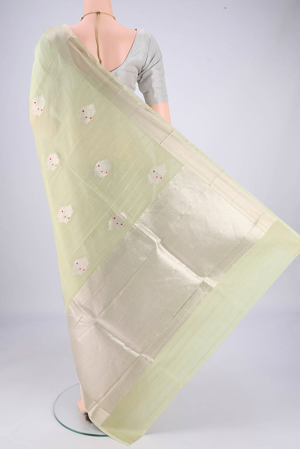 Flat view of Mint Green Chanderi Silk Cotton Saree with Zari Butta on the body and Zari Border. 