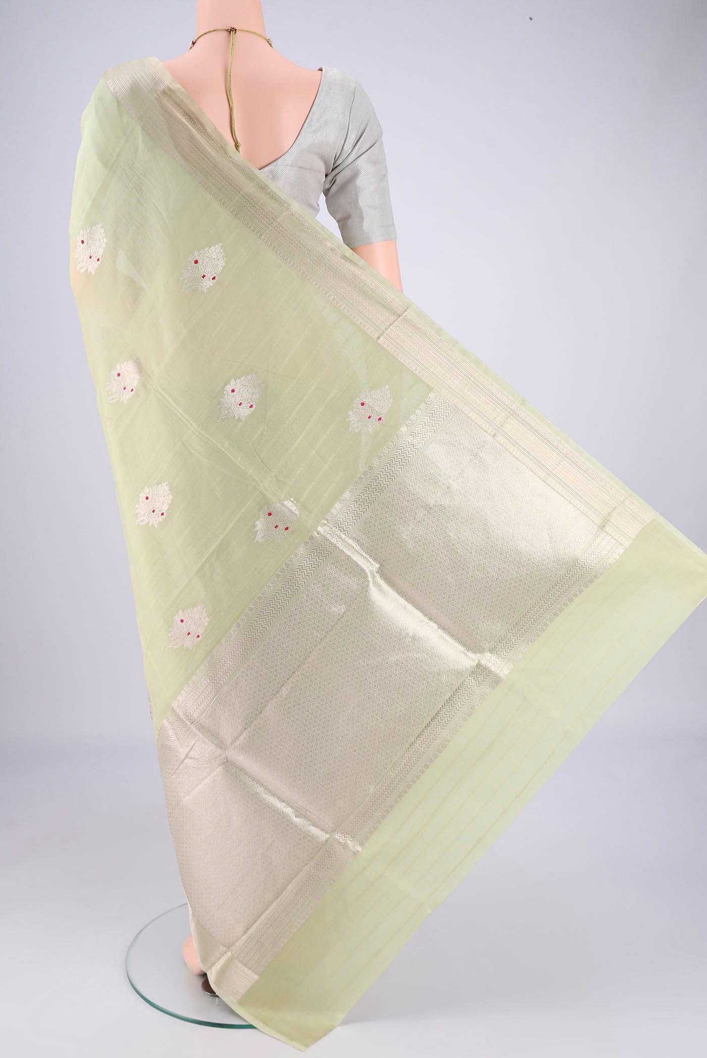 Flat view of Mint Green Chanderi Silk Cotton Saree with Zari Butta on the body and Zari Border. 