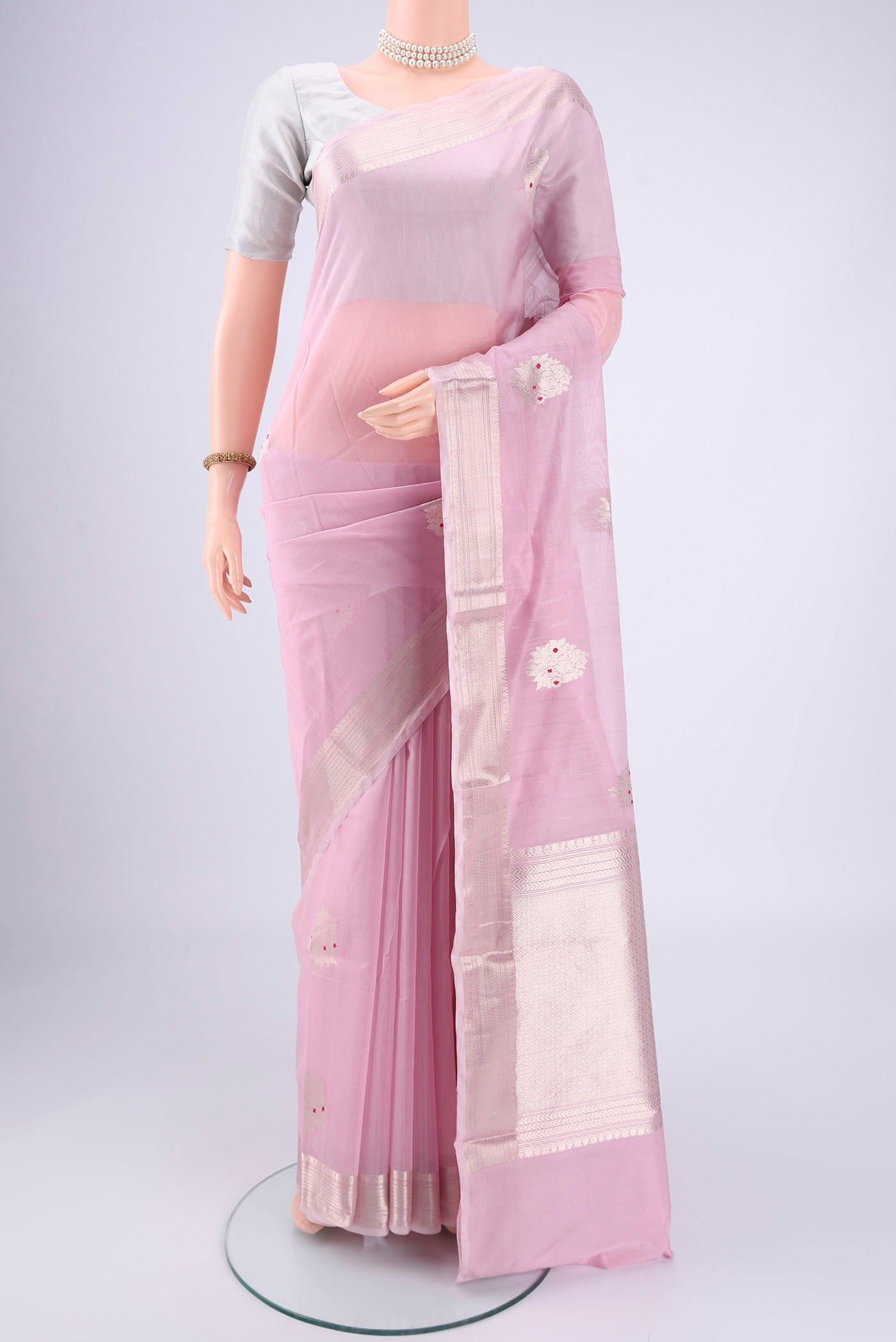 Rose pink Chanderi Silk Cotton Saree with Zari Butta on the body and Zari Border.  displayed on a mannequin