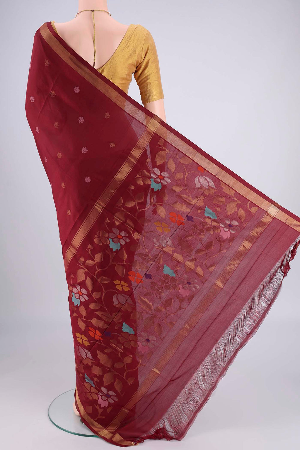 Flat view of Maroon Uppada Silk Saree with Zari And Thread Butta on the body and Zari Border. 