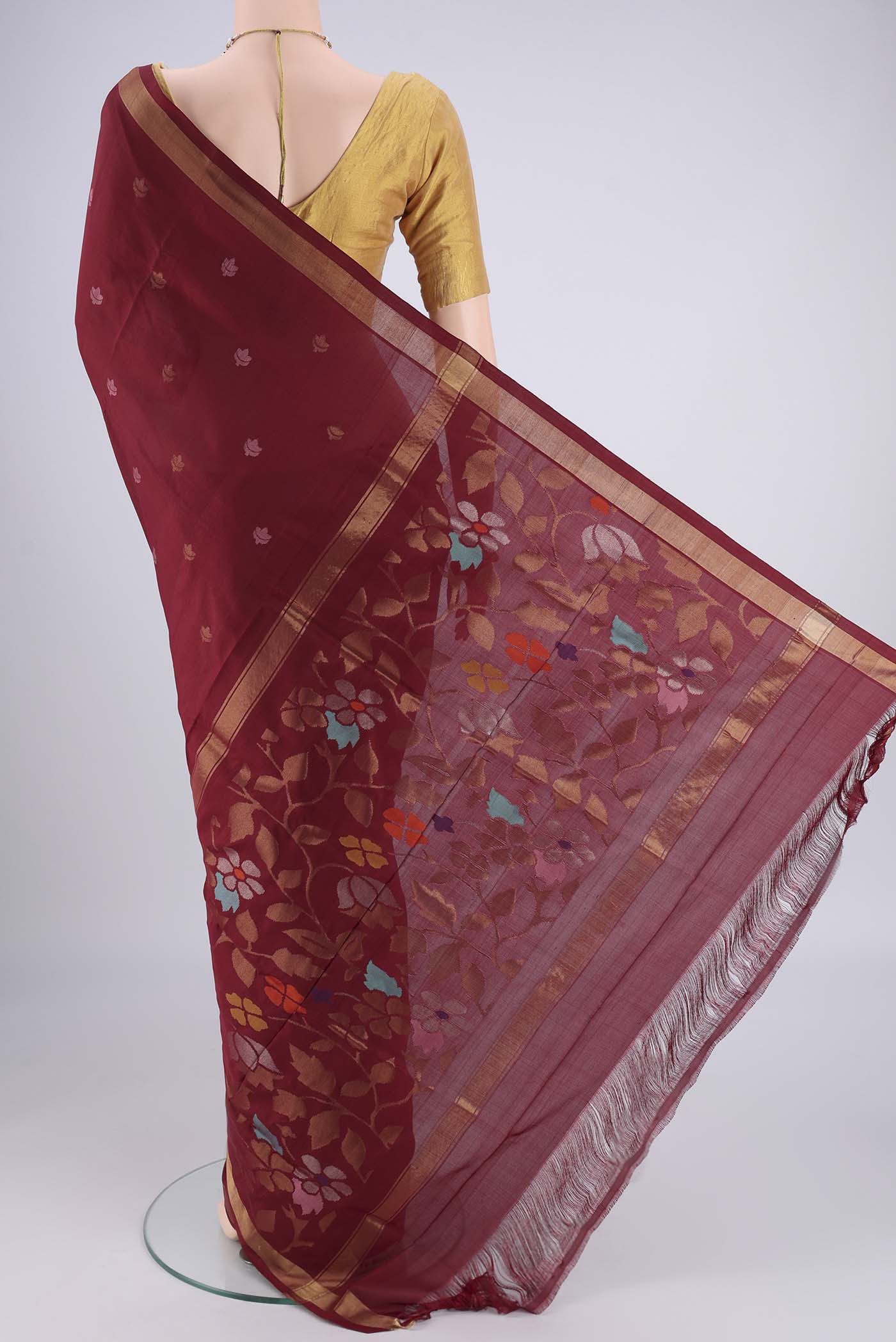 Flat view of Maroon Uppada Silk Saree with Zari And Thread Butta on the body and Zari Border. 