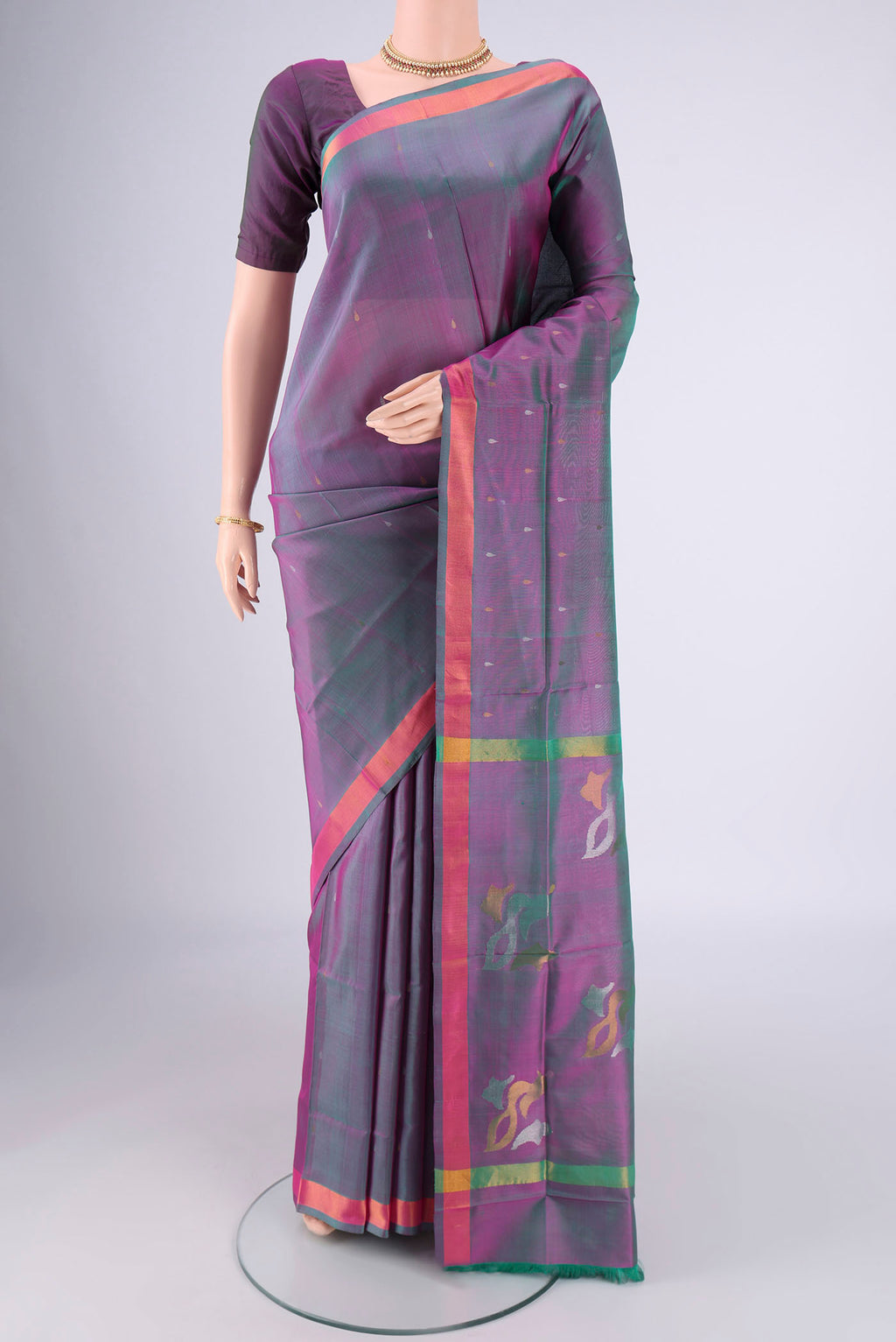 Lavender Dual Tone Uppada Silk Saree with Zari Butta on the body and Zari Border.  displayed on a mannequin
