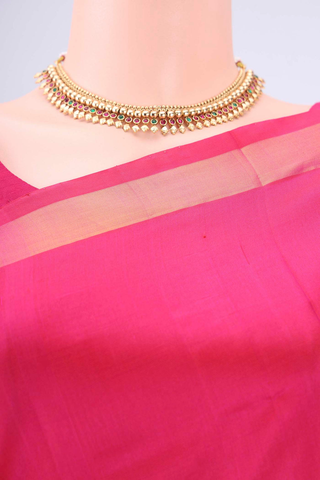 Border image of Rani Pink Uppada Silk Saree with Zari Butta on the body and Zari Border. 