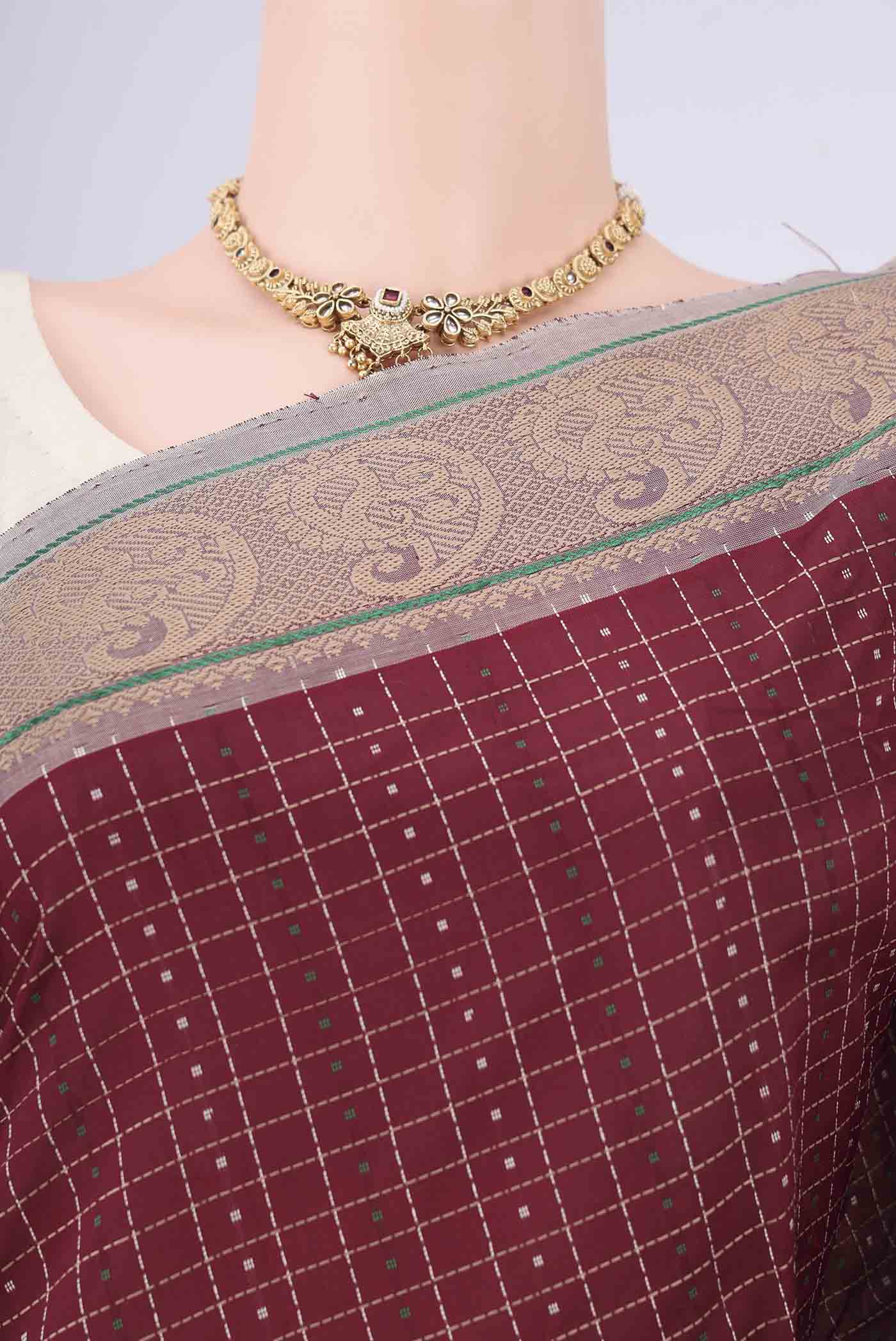 Border image of Maroon Blended Poly Cotton Saree with Checked design on the body and Thread Border. 