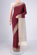 Maroon Blended Poly Cotton Saree with Checked design on the body and Thread Border.  displayed on a mannequin