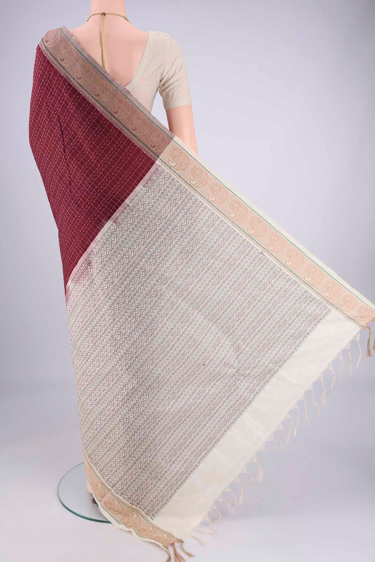 Flat view of Maroon Blended Poly Cotton Saree with Checked design on the body and Thread Border. 