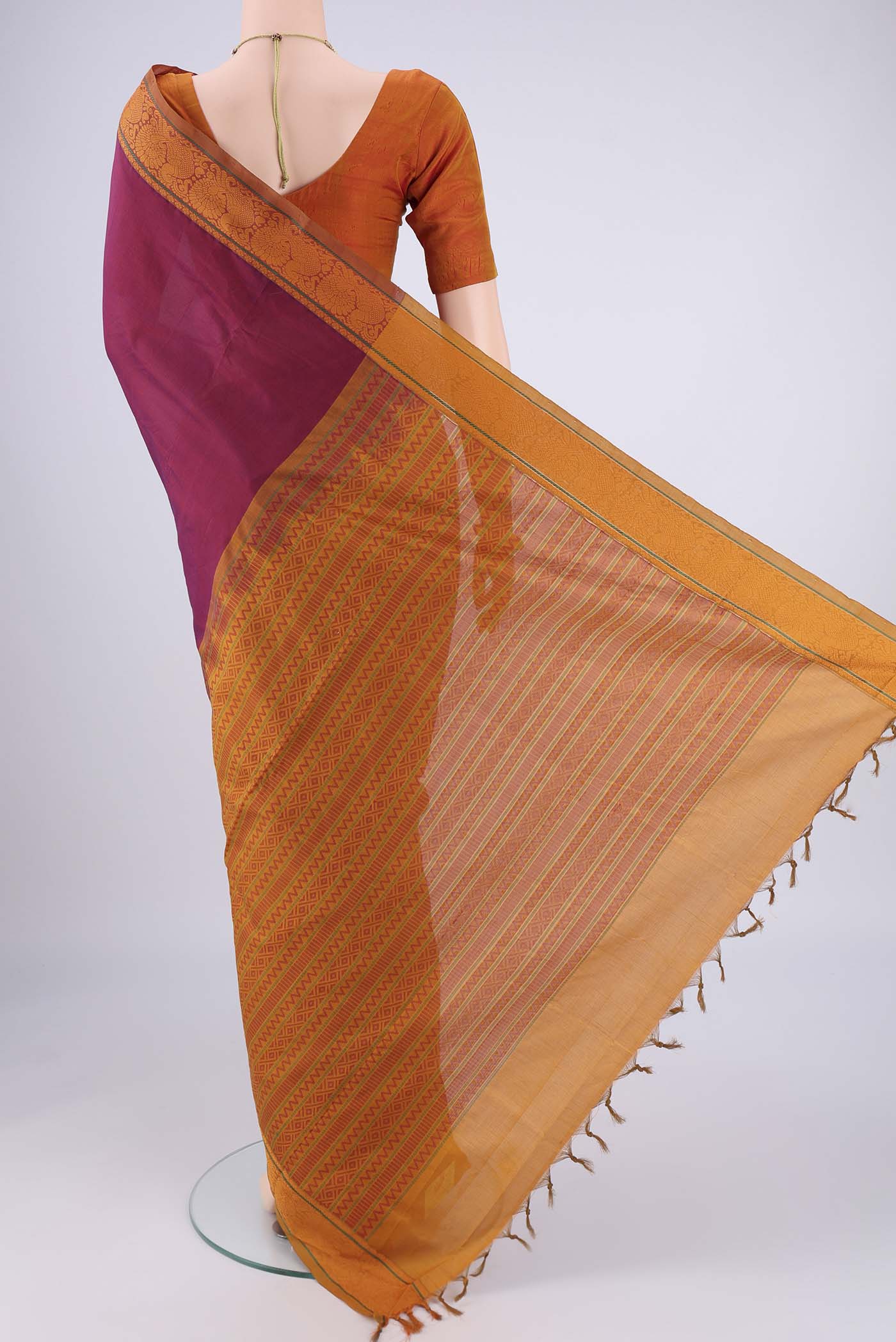 Flat view of Magenta Blended Poly Cotton Saree with Plain Body and Thread Border. 