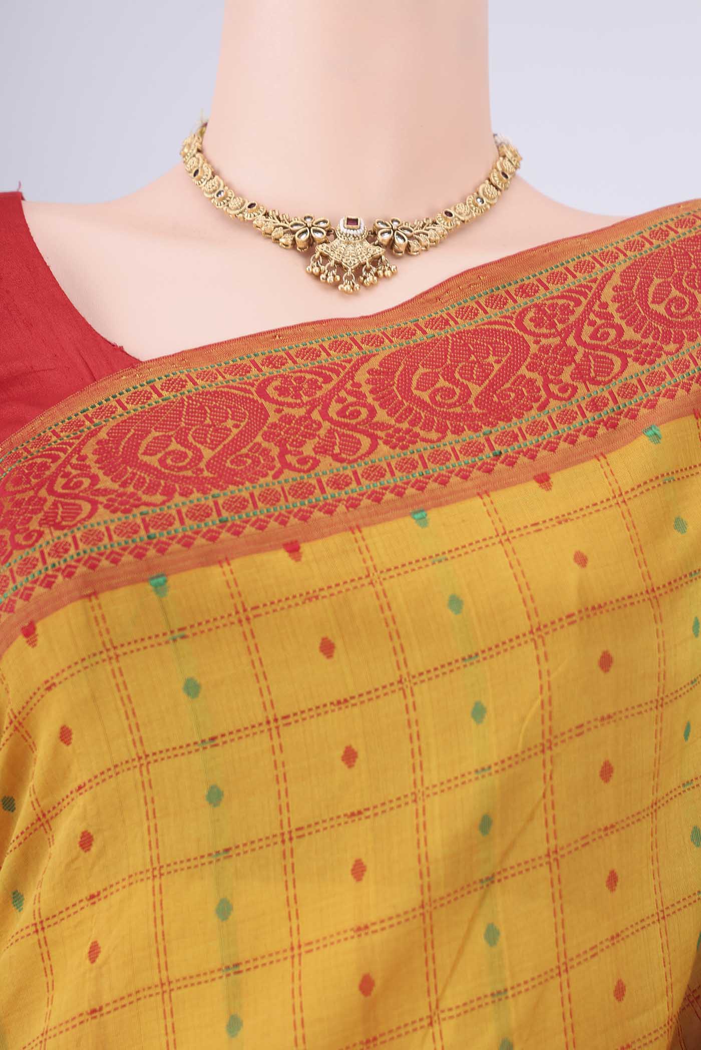 Border image of Yellow Blended Poly Cotton Saree with Checked design on the body and Thread Border. 