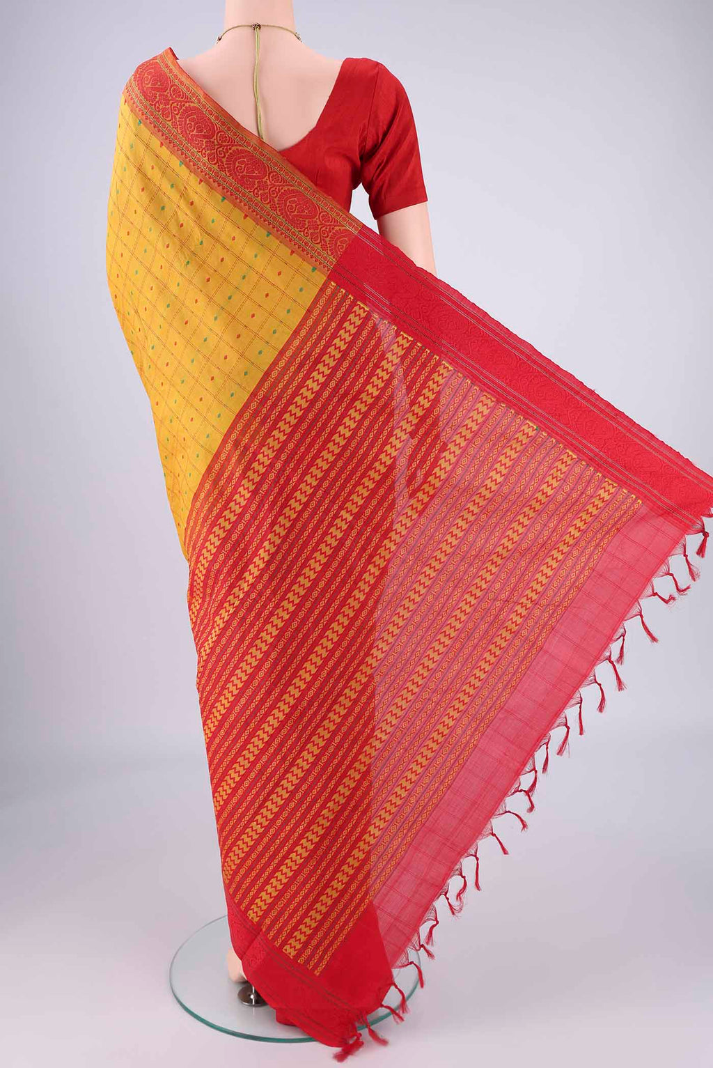 Flat view of Yellow Blended Poly Cotton Saree with Checked design on the body and Thread Border. 