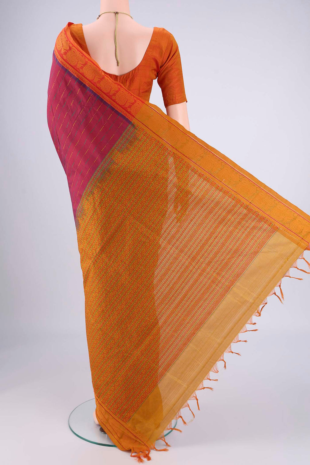 Flat view of Magenta Blended Poly Cotton Saree with Stripes on the body and Thread Border. 