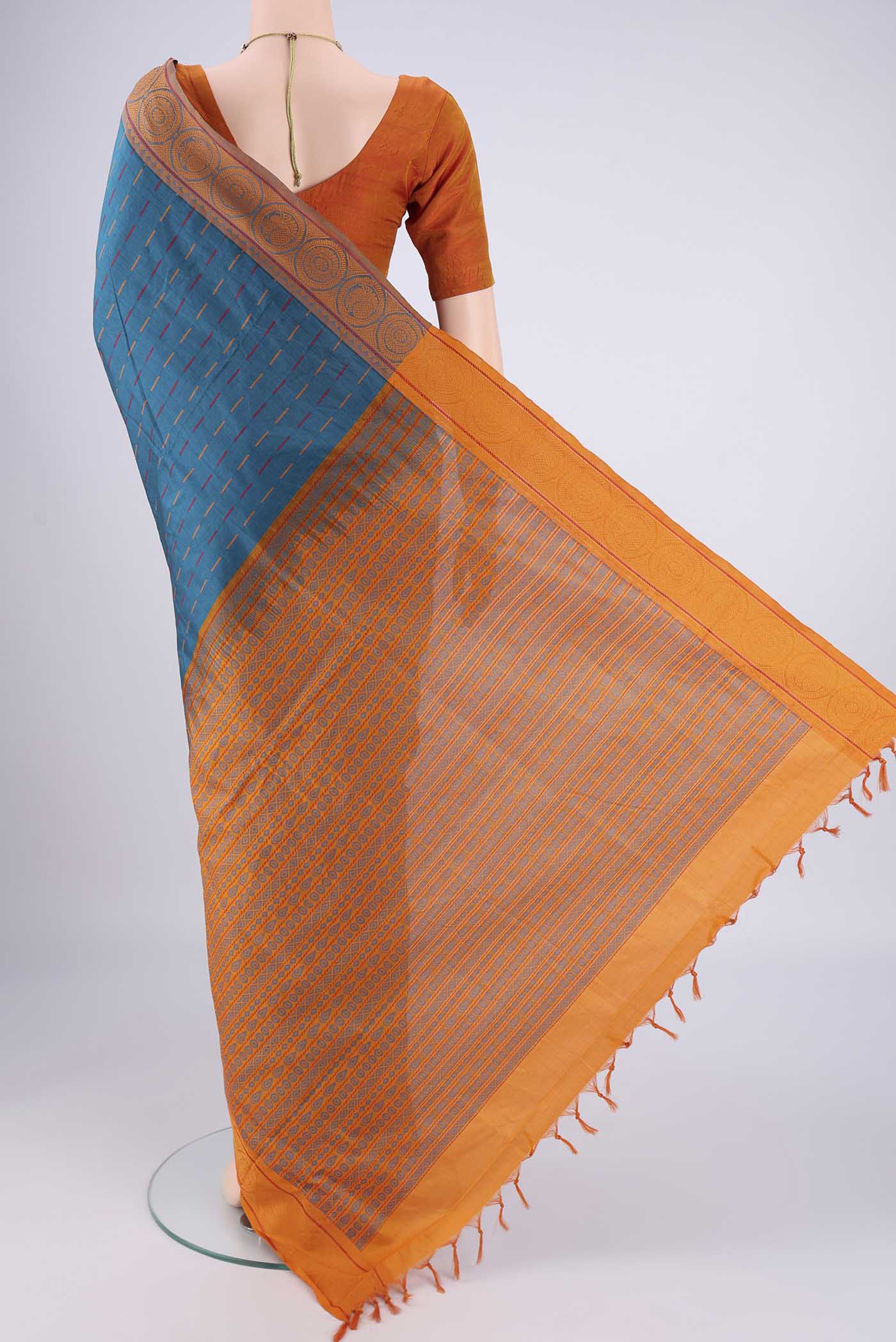 Flat view of Blue Blended Poly Cotton Saree with Stripes on the body and Thread Border. 