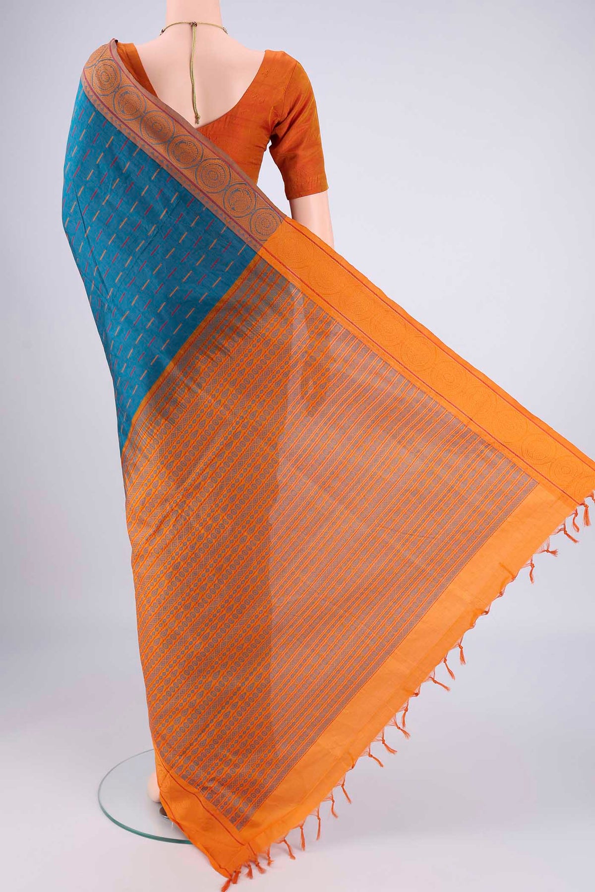 Flat view of Blue Blended Poly Cotton Saree with Stripes on the body and Thread Border. 