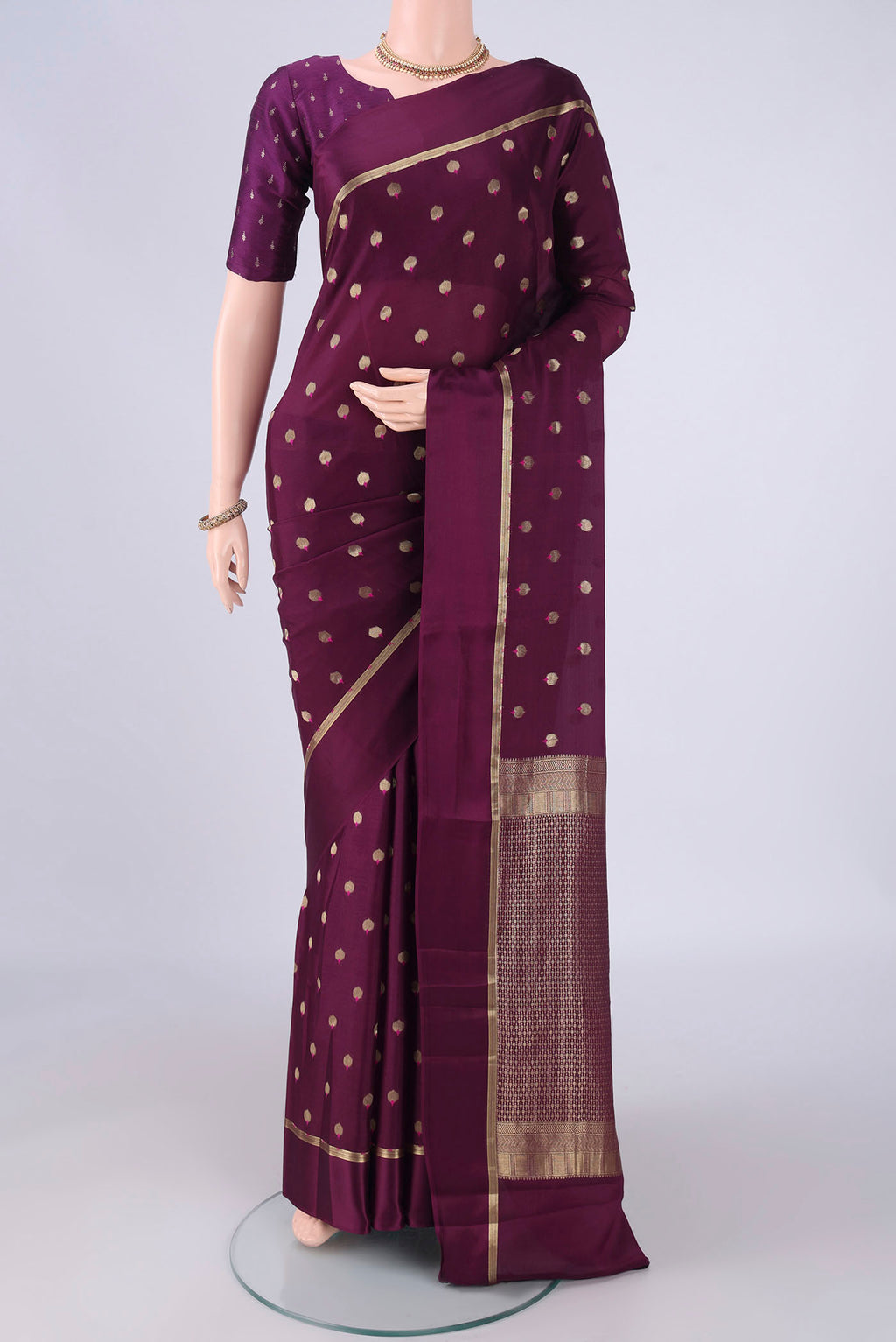 Purple Mysore Crepe Saree with Zari And Thread Butta on the body and Zari Border.  displayed on a mannequin