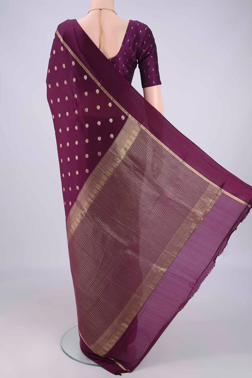 Flat view of Purple Mysore Crepe Saree with Zari And Thread Butta on the body and Zari Border. 