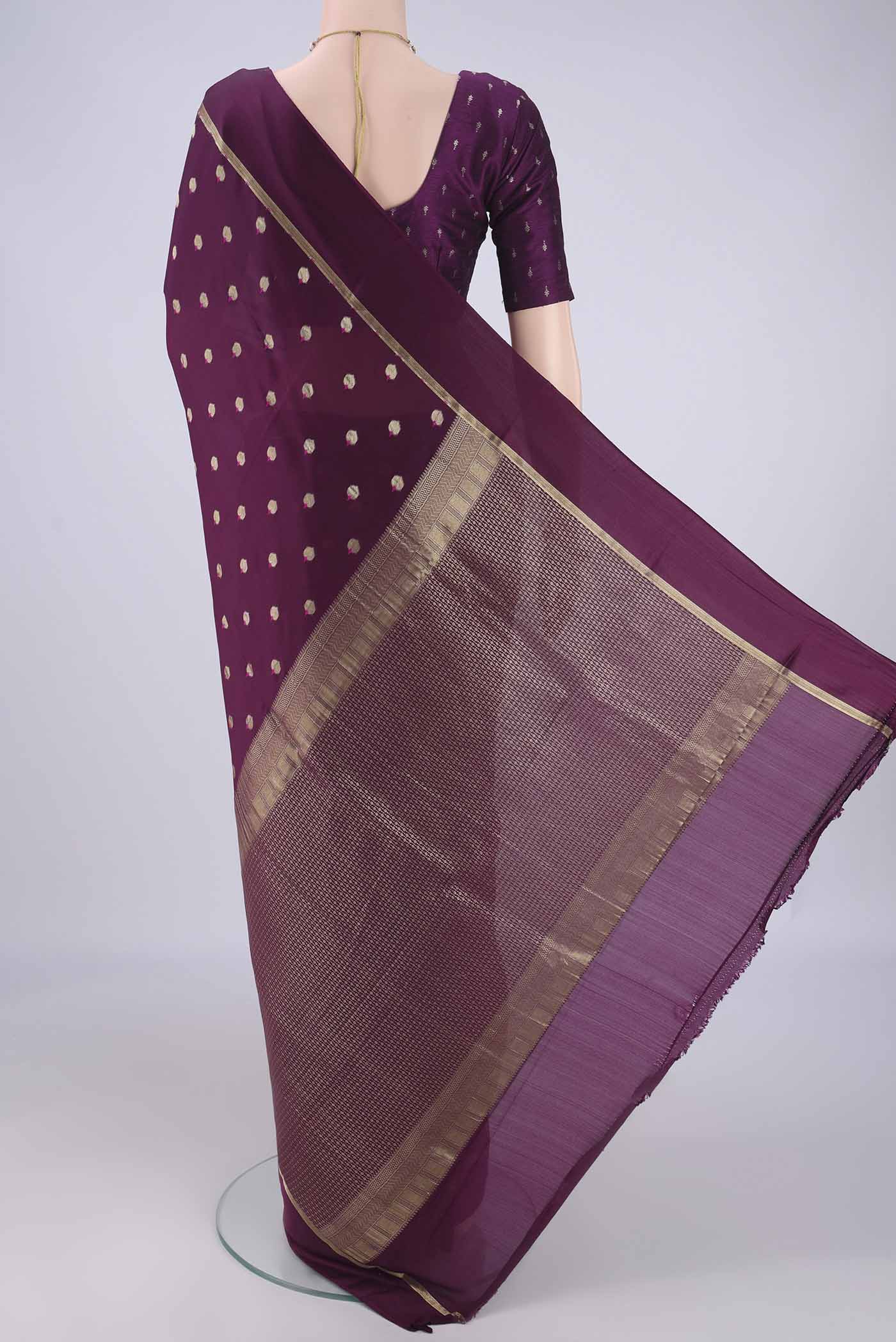 Flat view of Purple Mysore Crepe Saree with Zari And Thread Butta on the body and Zari Border. 