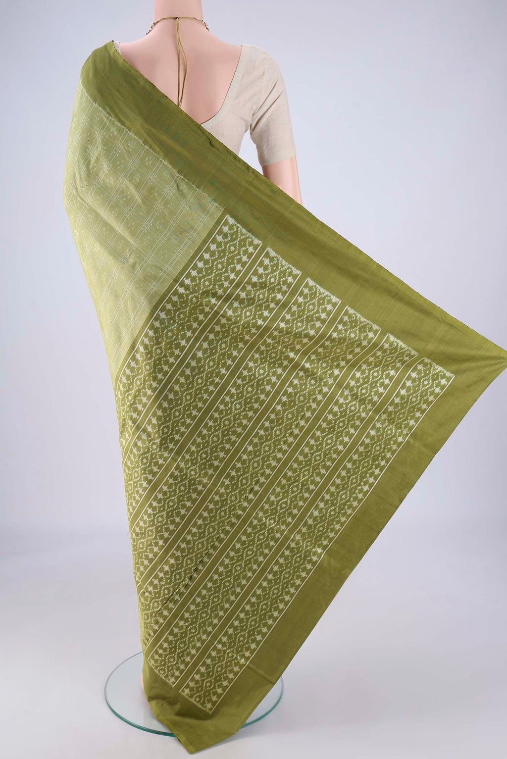 Flat view of Light Green Pochampally Silk Saree with Checked design on the body and Plain Border. 