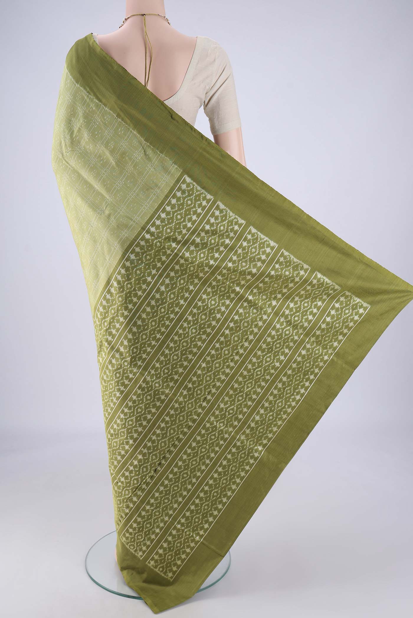 Flat view of Light Green Pochampally Silk Saree with Checked design on the body and Plain Border. 