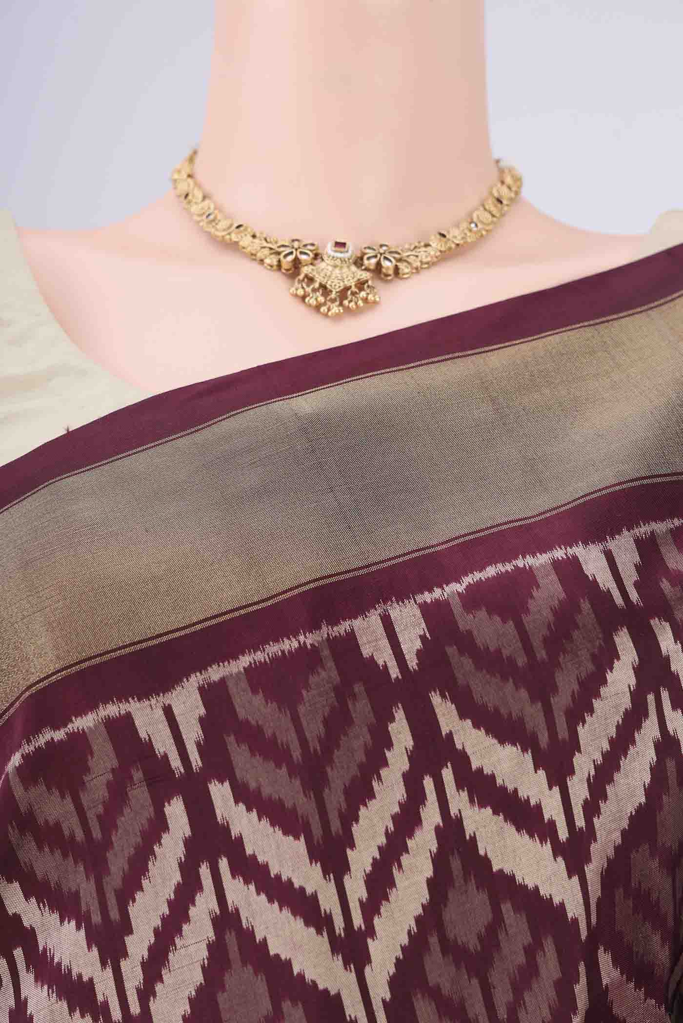 Border image of Coffee Brown Pochampally Silk Saree with Ikat design on the body and Zari Border. 