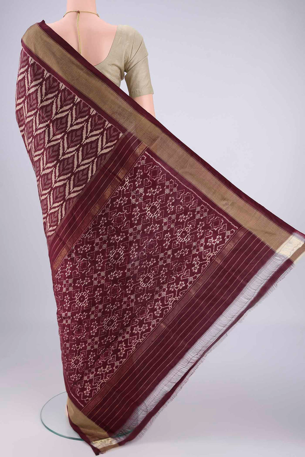 Flat view of Coffee Brown Pochampally Silk Saree with Ikat design on the body and Zari Border. 